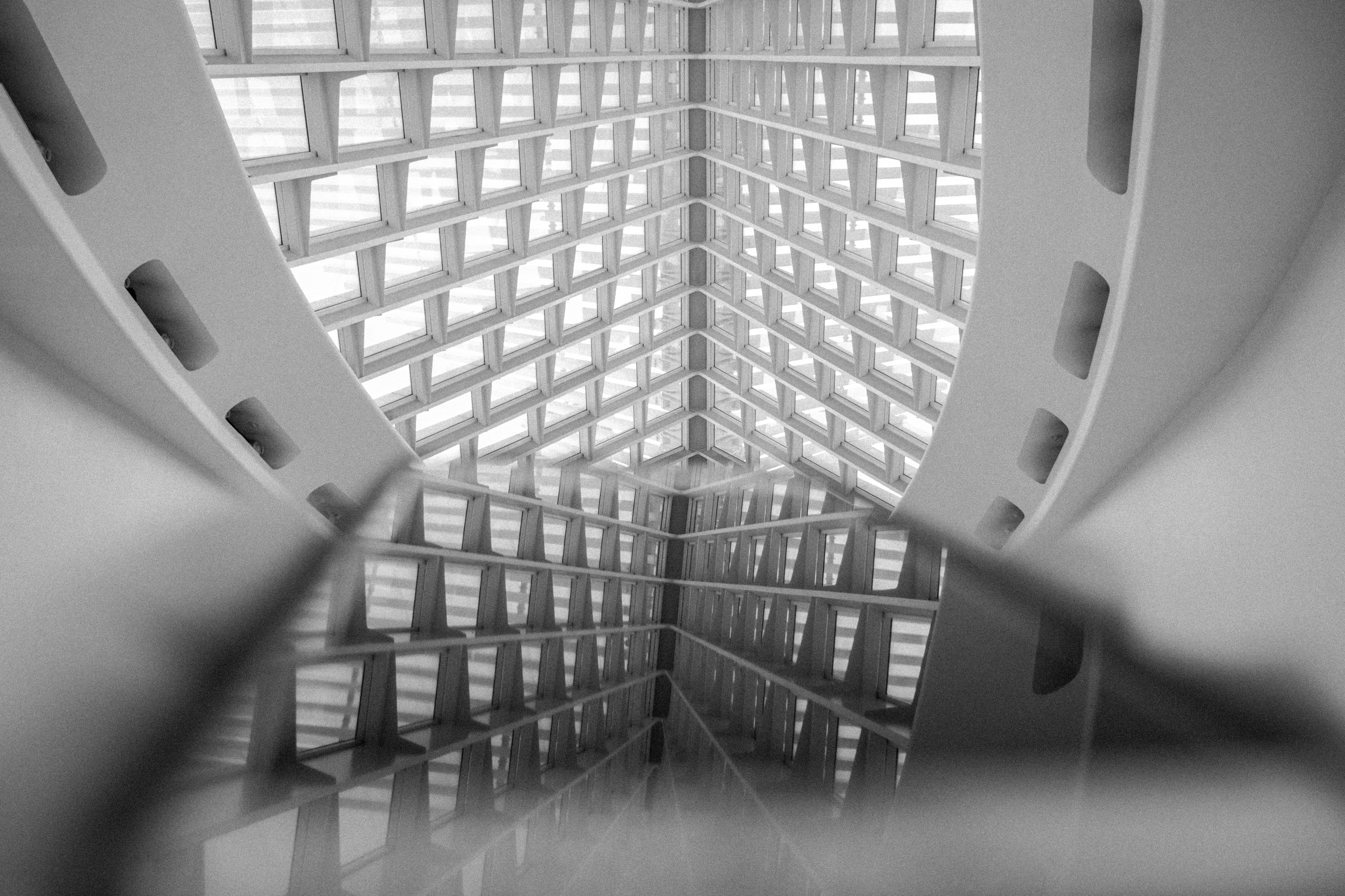 Abstract interior of a modern building with a glass ceiling and reflections HD Wallpaper