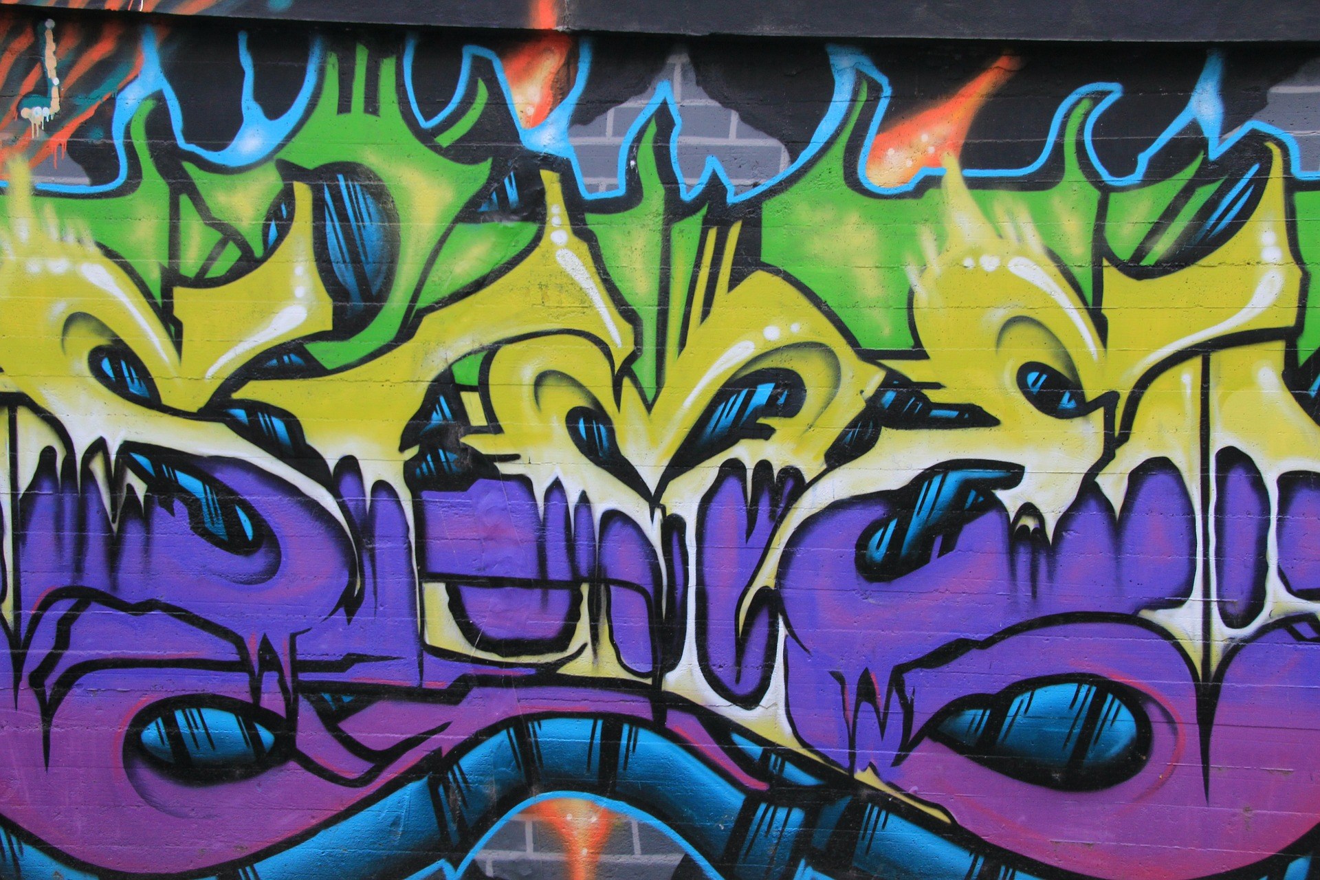 Graffiti art with purple, yellow, and green colors HD Wallpaper