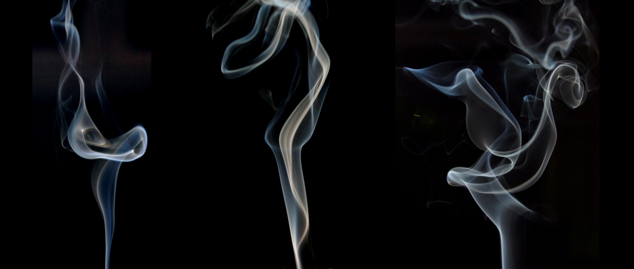 Smoke wisps against a black background HD Wallpaper