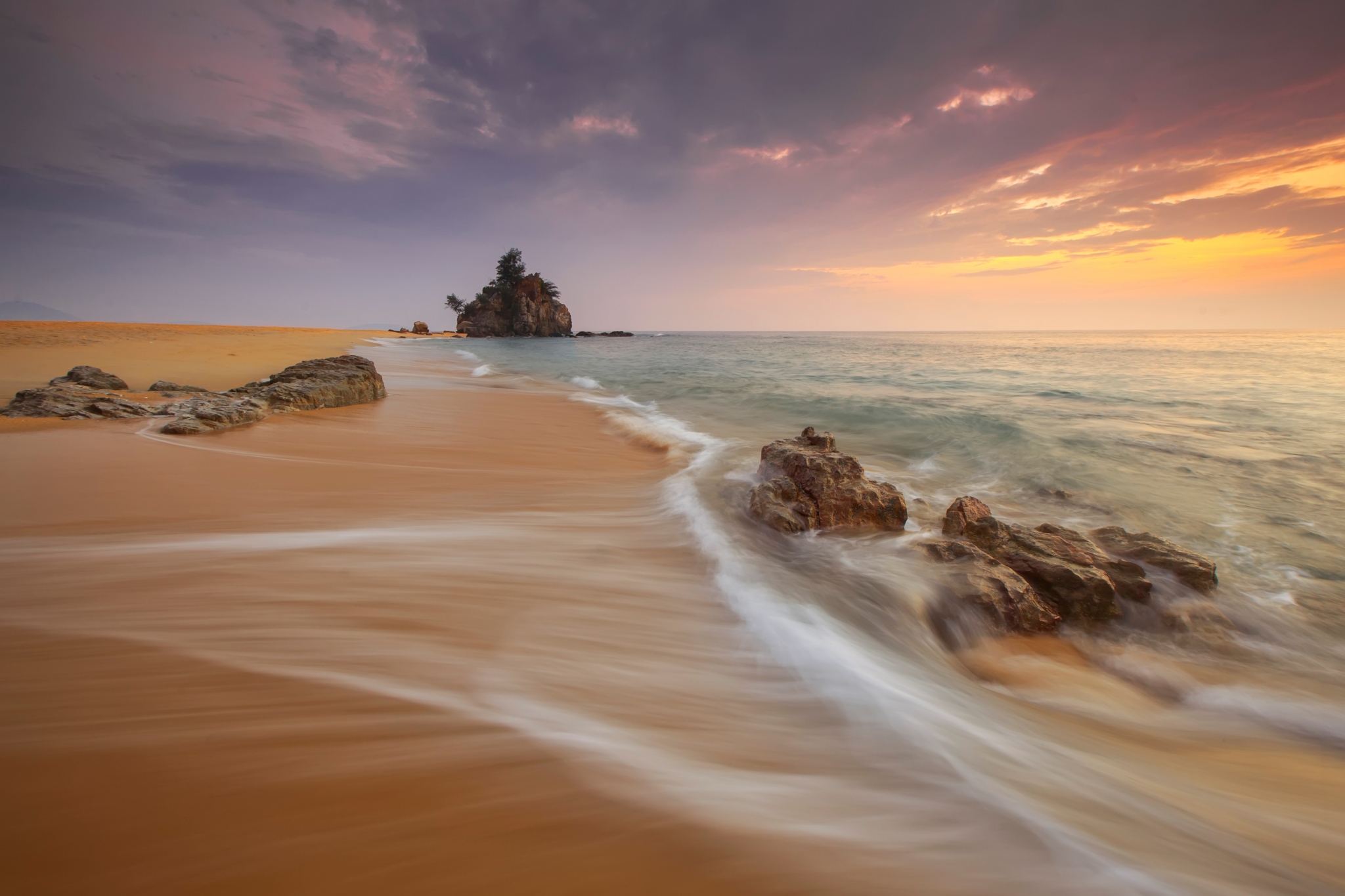 Beach with rocks and ocean waves at sunset HD Wallpaper