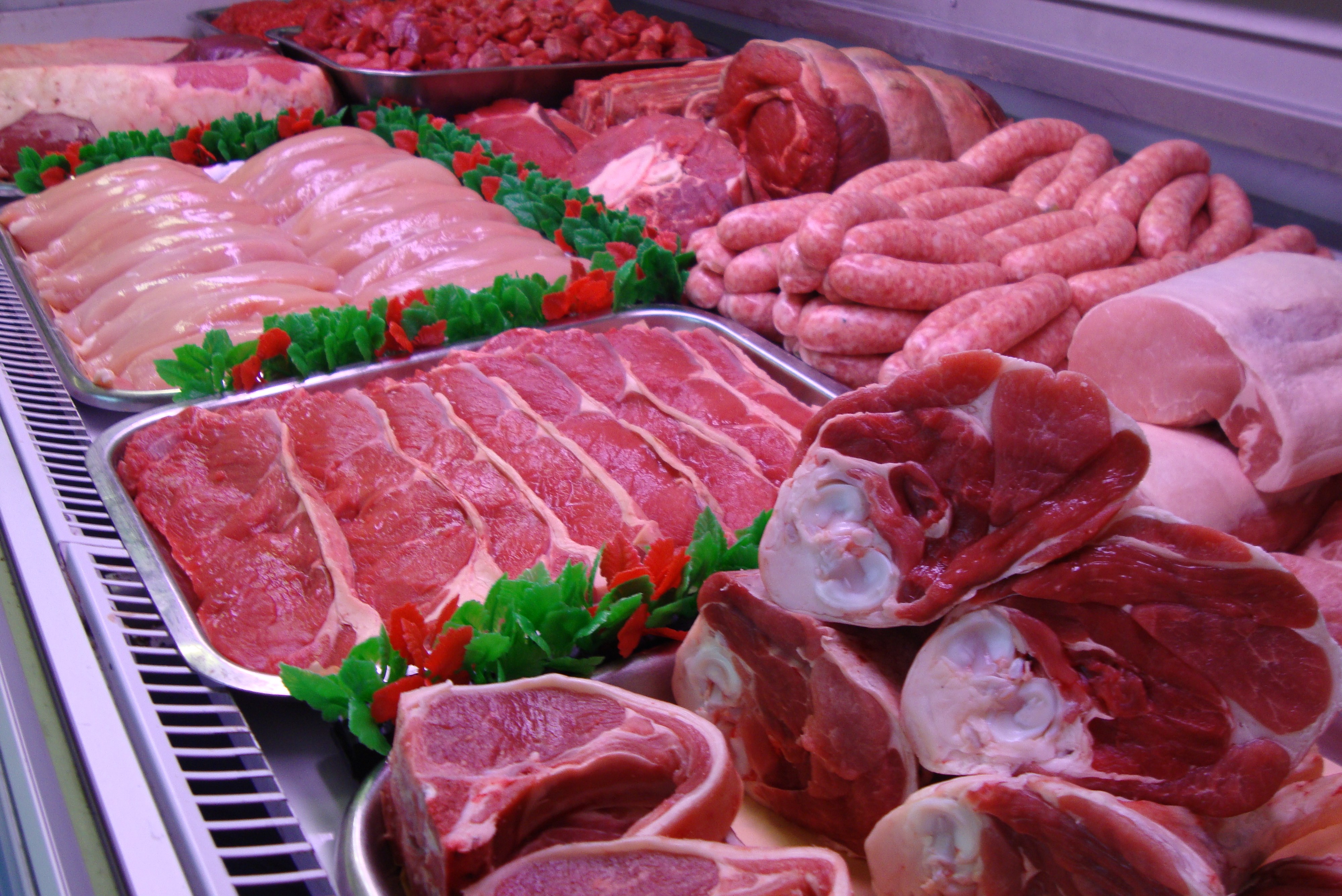 Assorted Fresh Raw Meats in Display Case HD Wallpaper