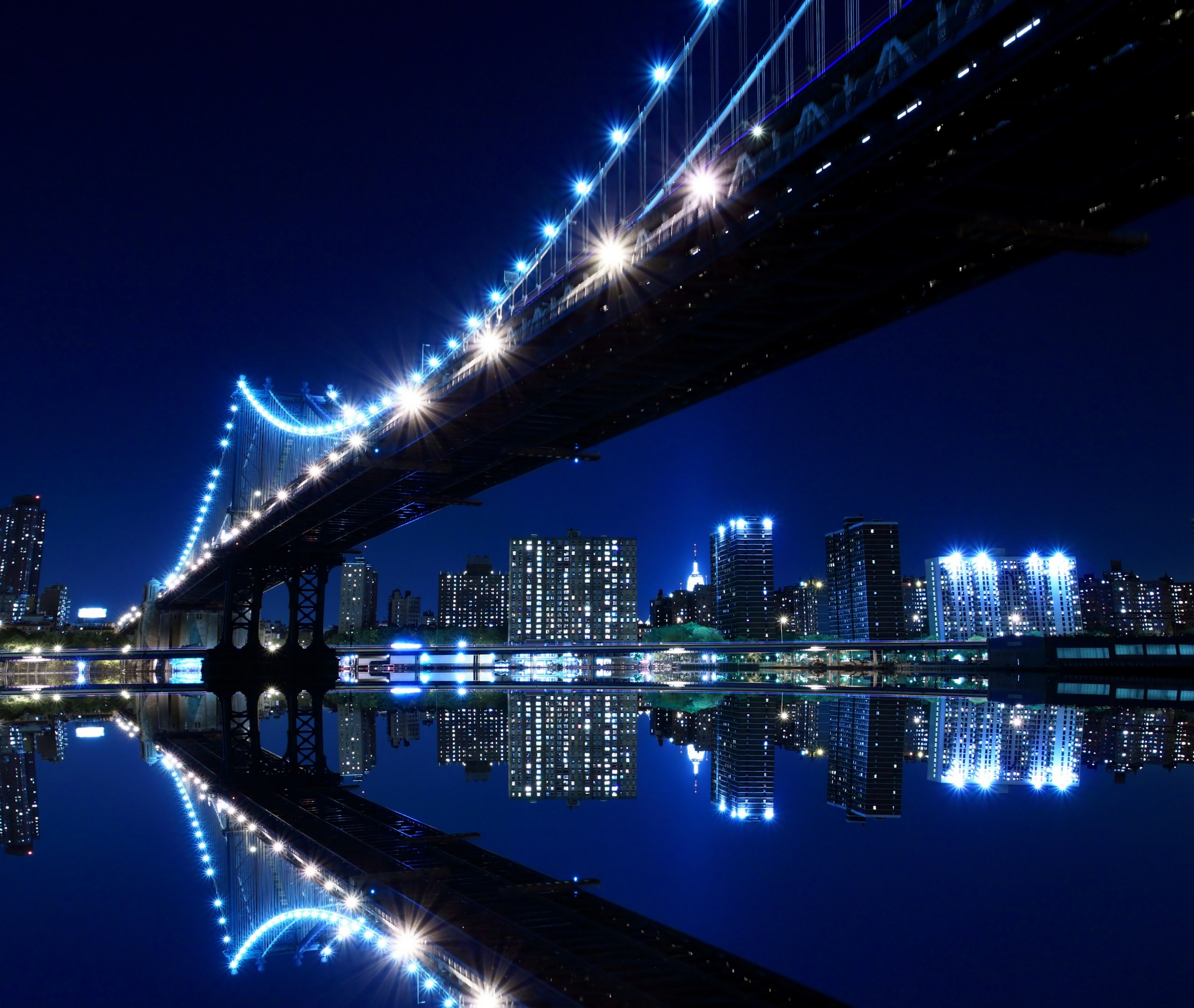 Manhattan Bridge at Night with City Skyline Reflection HD Wallpaper