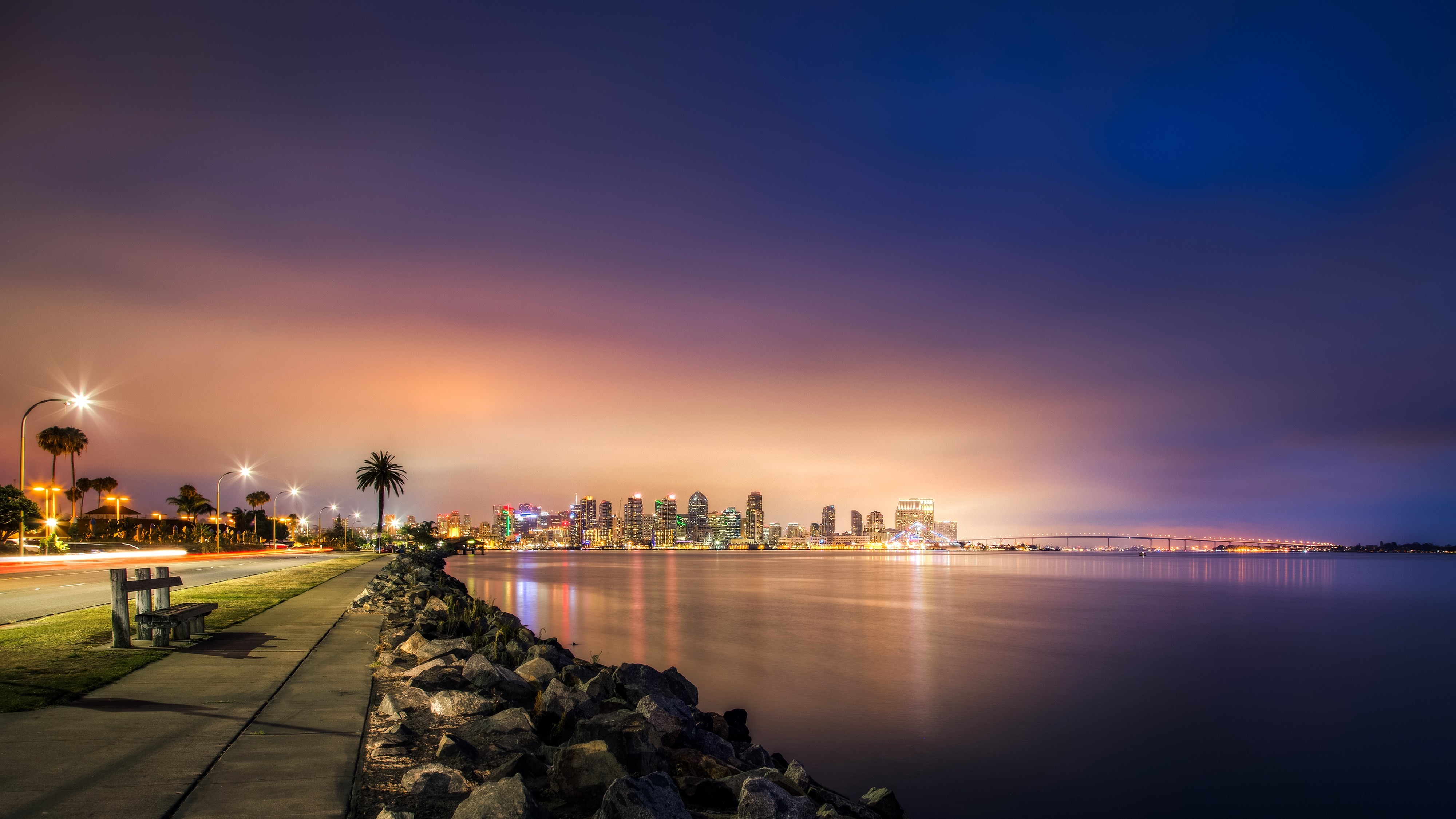 San Diego skyline at dusk with a waterfront promenade HD Wallpaper