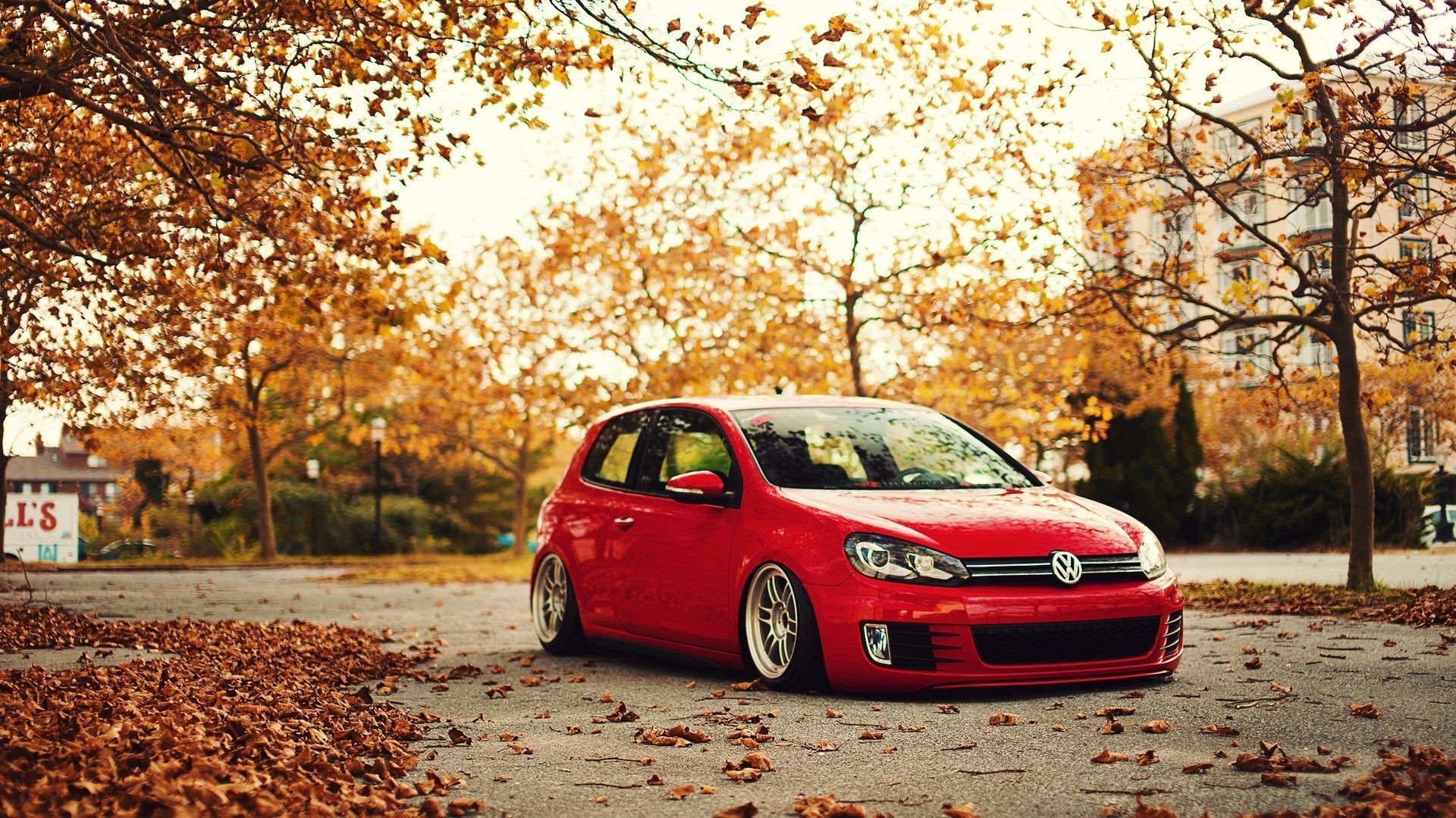 Red Volkswagen Golf on a Fall Day HD Wallpaper