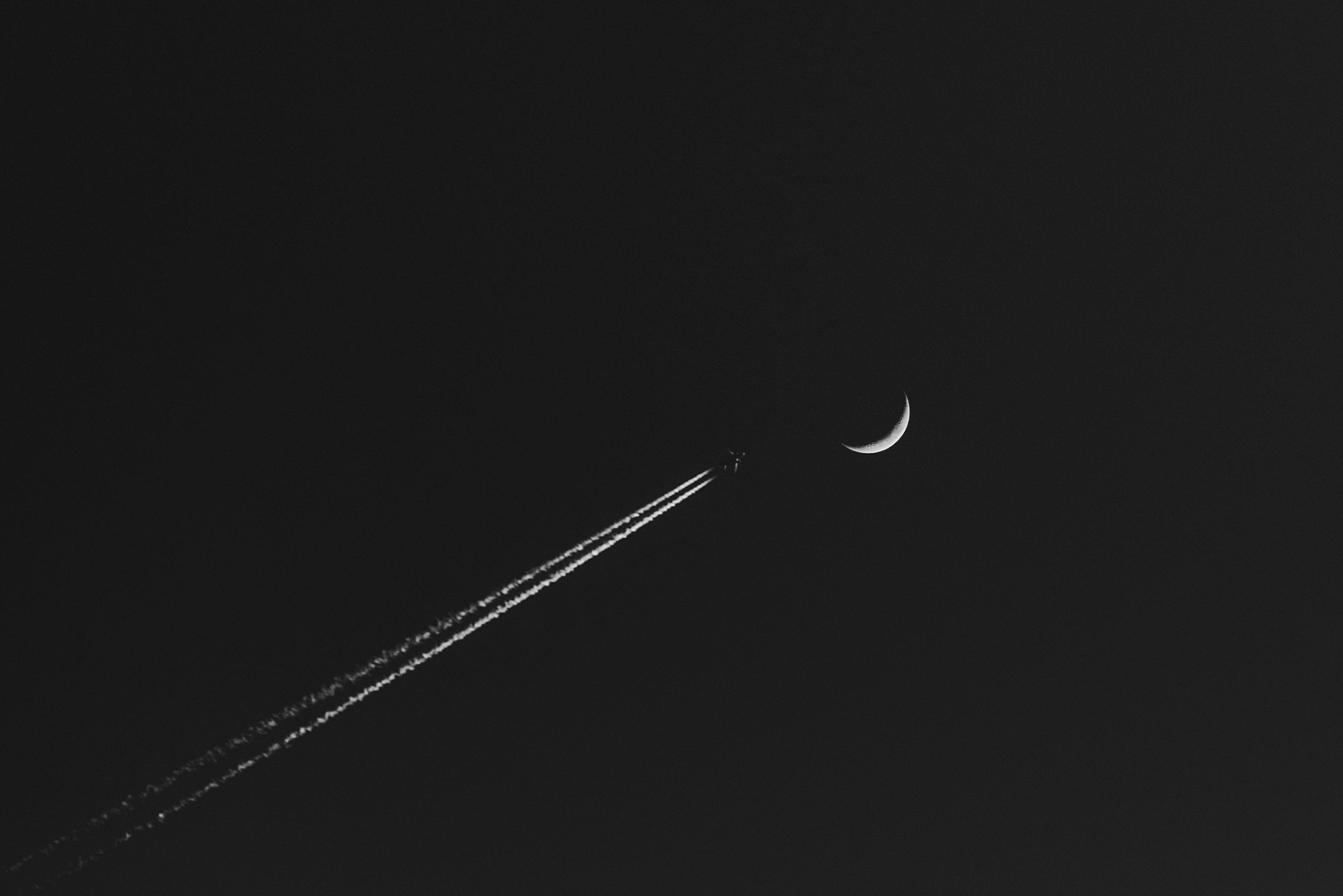 Airplane leaving contrail near crescent moon HD Wallpaper