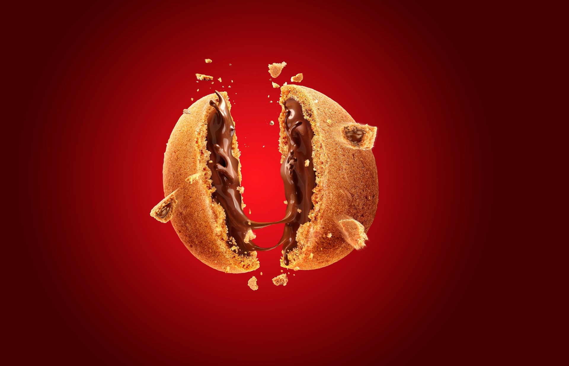 Chocolate cookie broken in half with molten chocolate HD Wallpaper