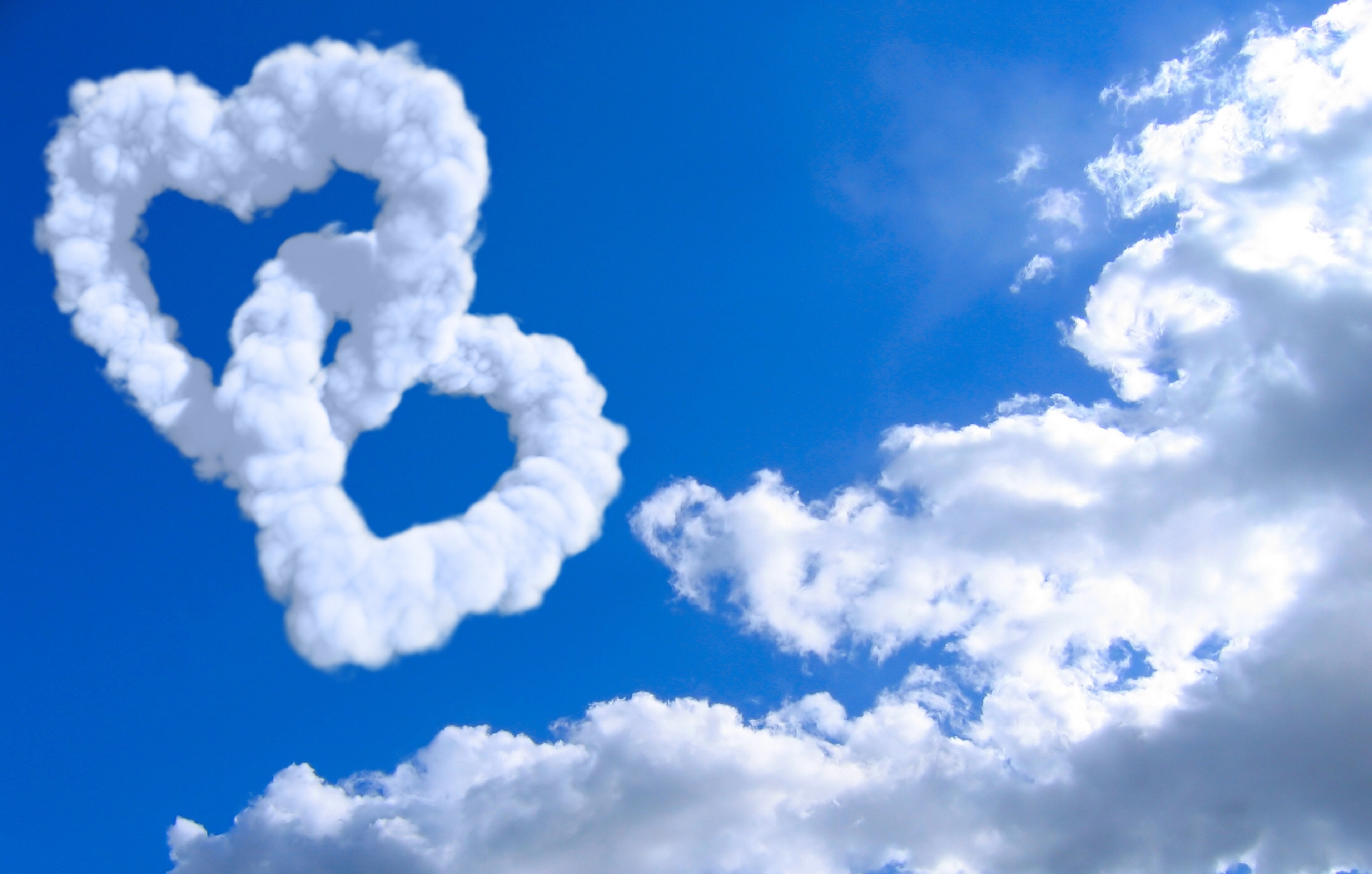 Two Intertwined Heart Clouds in Blue Sky 4K HD Wallpaper