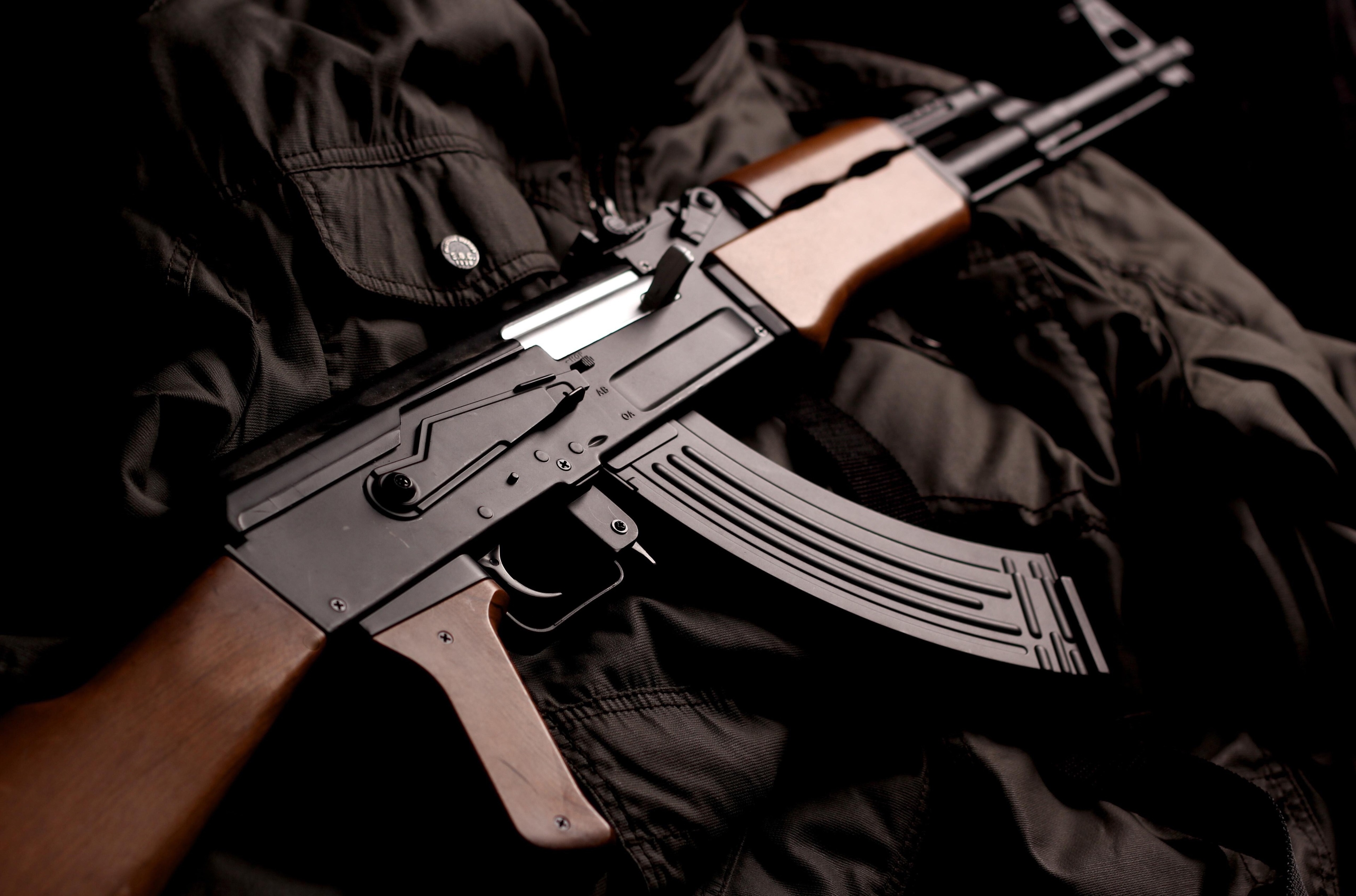 AK-74 rifle on a black jacket HD Wallpaper