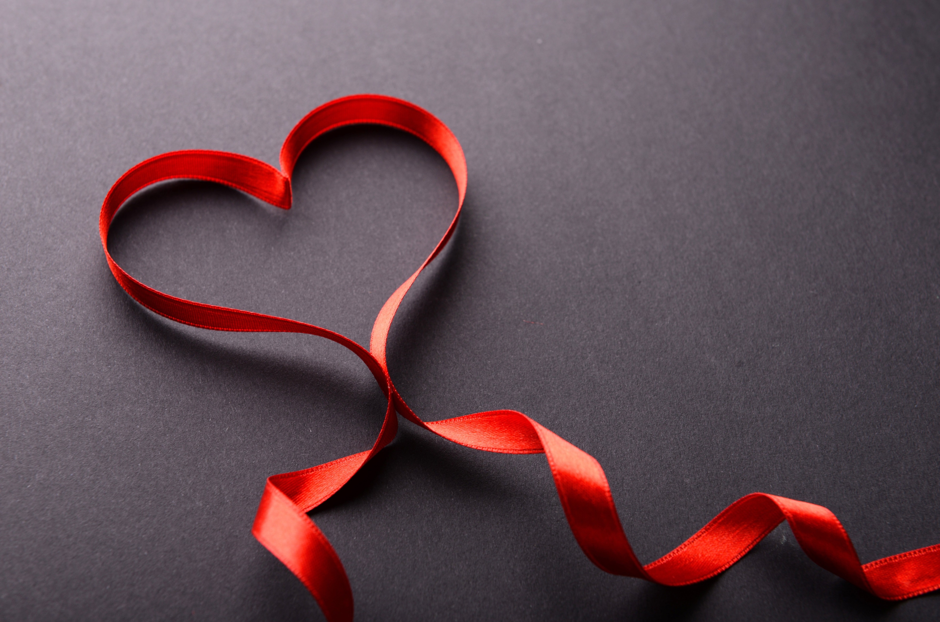 Red ribbon heart on dark background 4K HD Wallpaper