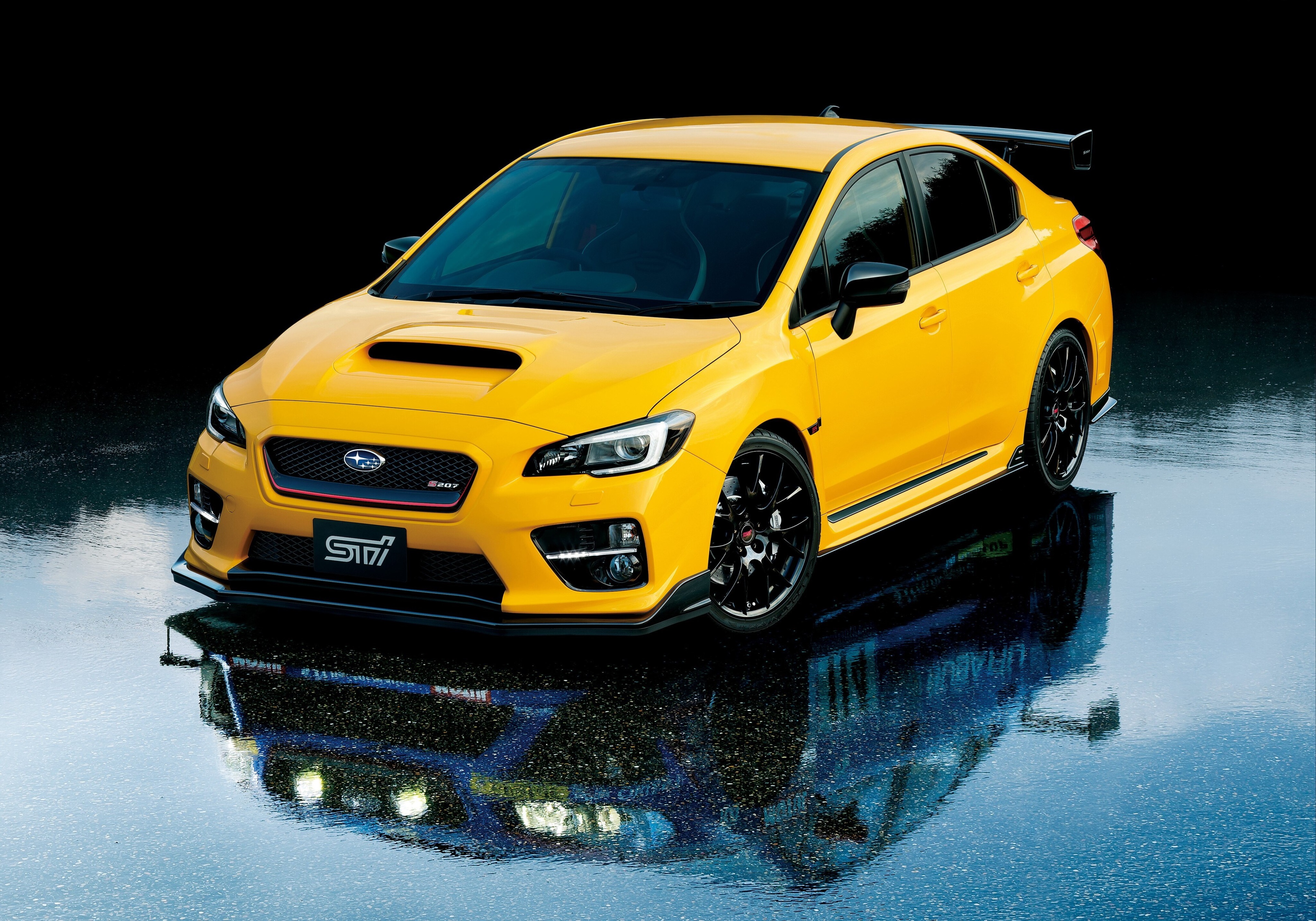 Yellow Subaru WRX STI S207 on wet surface HD Wallpaper