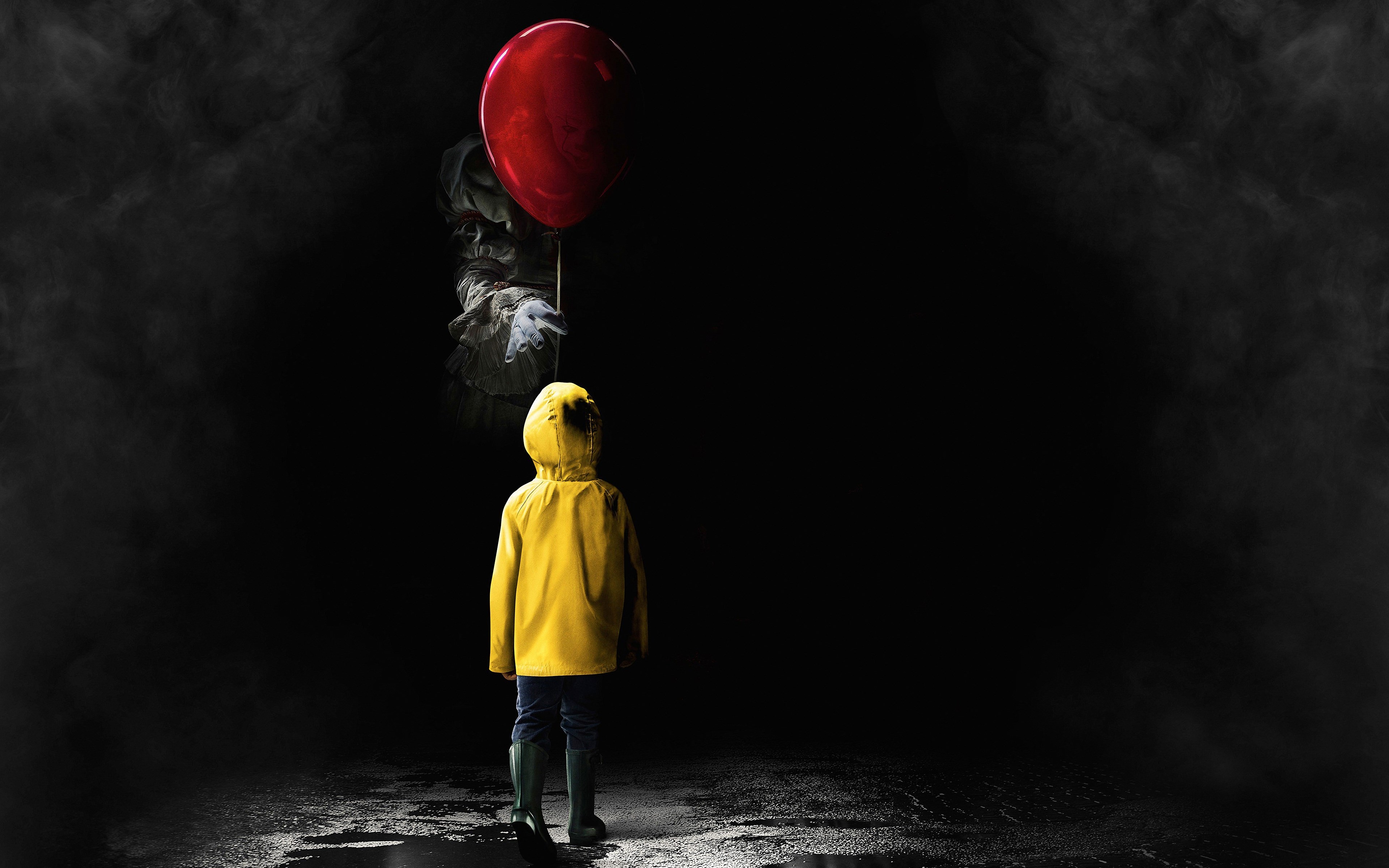 Pennywise with balloon and child from It HD Wallpaper