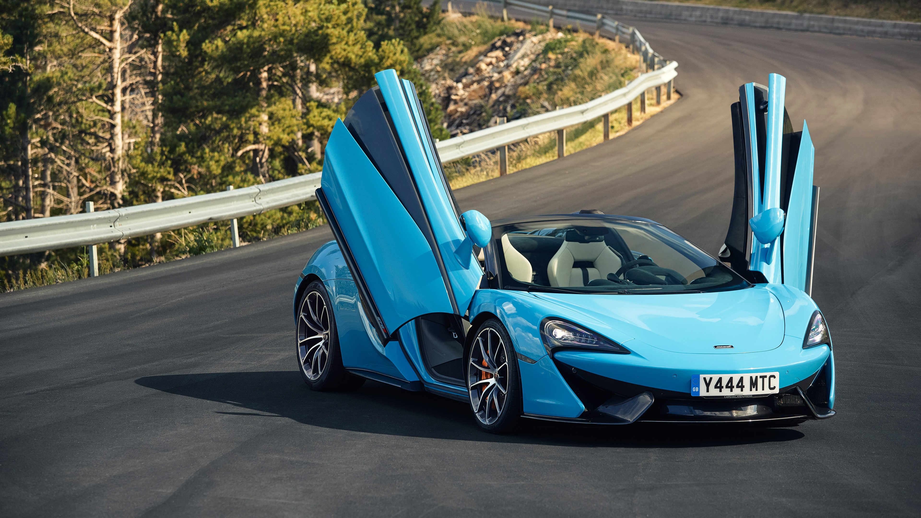 Blue McLaren 570S Spider with Doors Up 4K HD Wallpaper