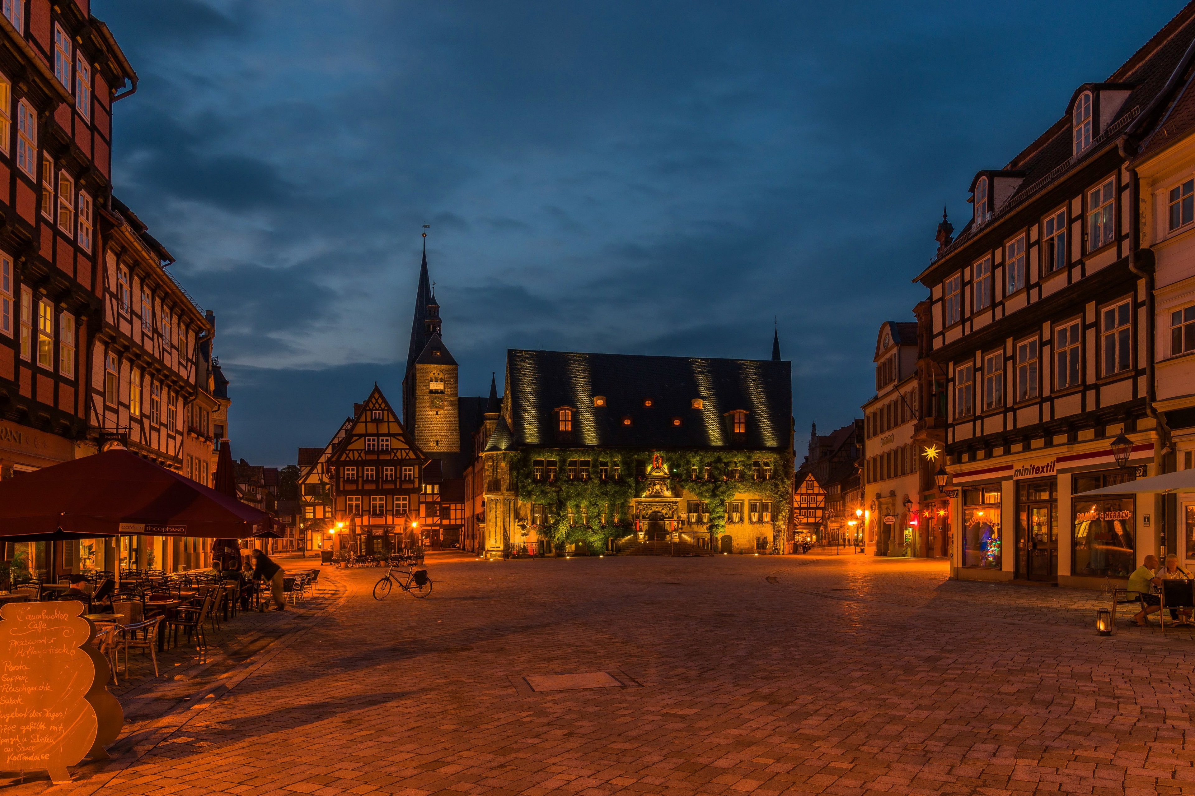 Town square at dusk with historic buildings HD Wallpaper