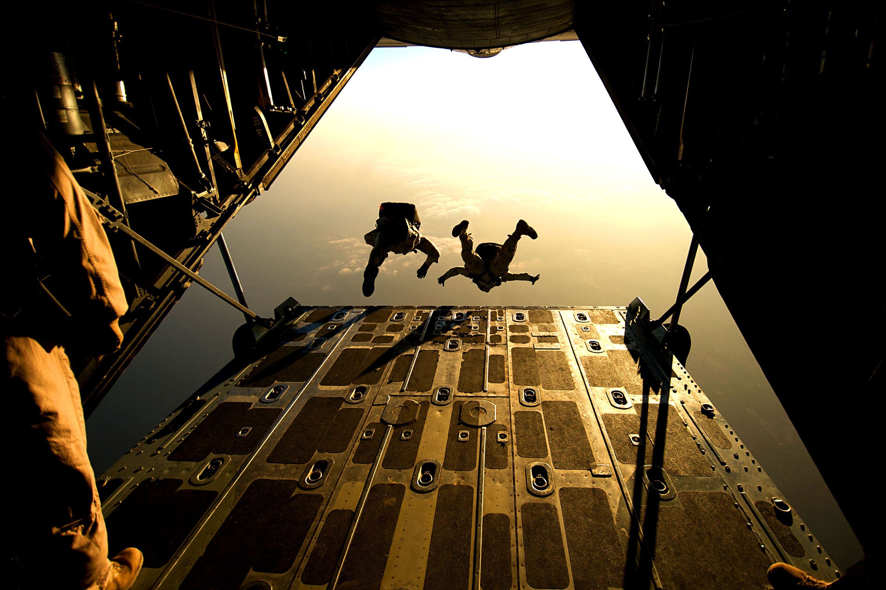 Military paratroopers jumping from an aircraft HD Wallpaper