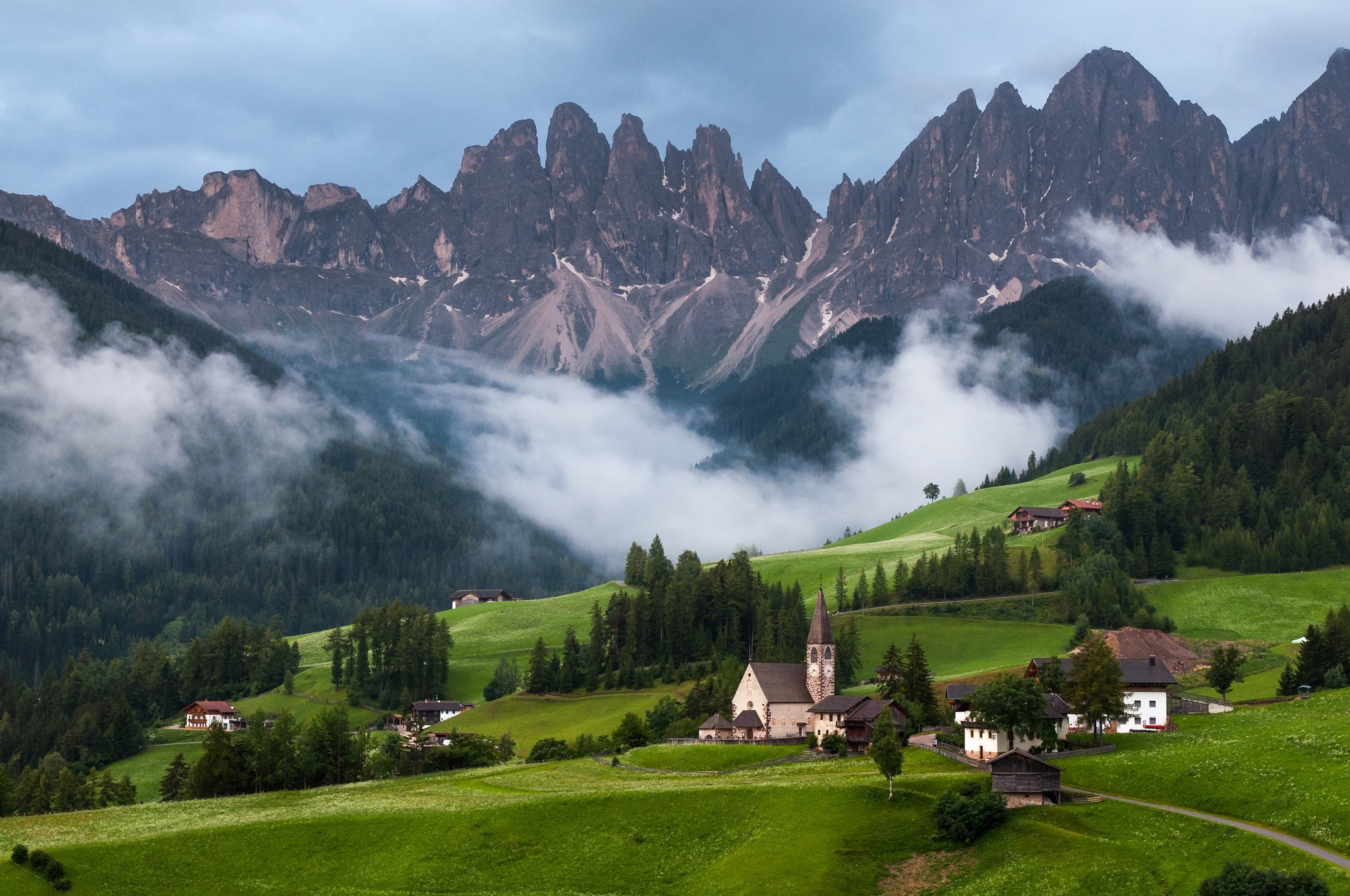 Village church in the Dolomites mountains with mist HD Wallpaper