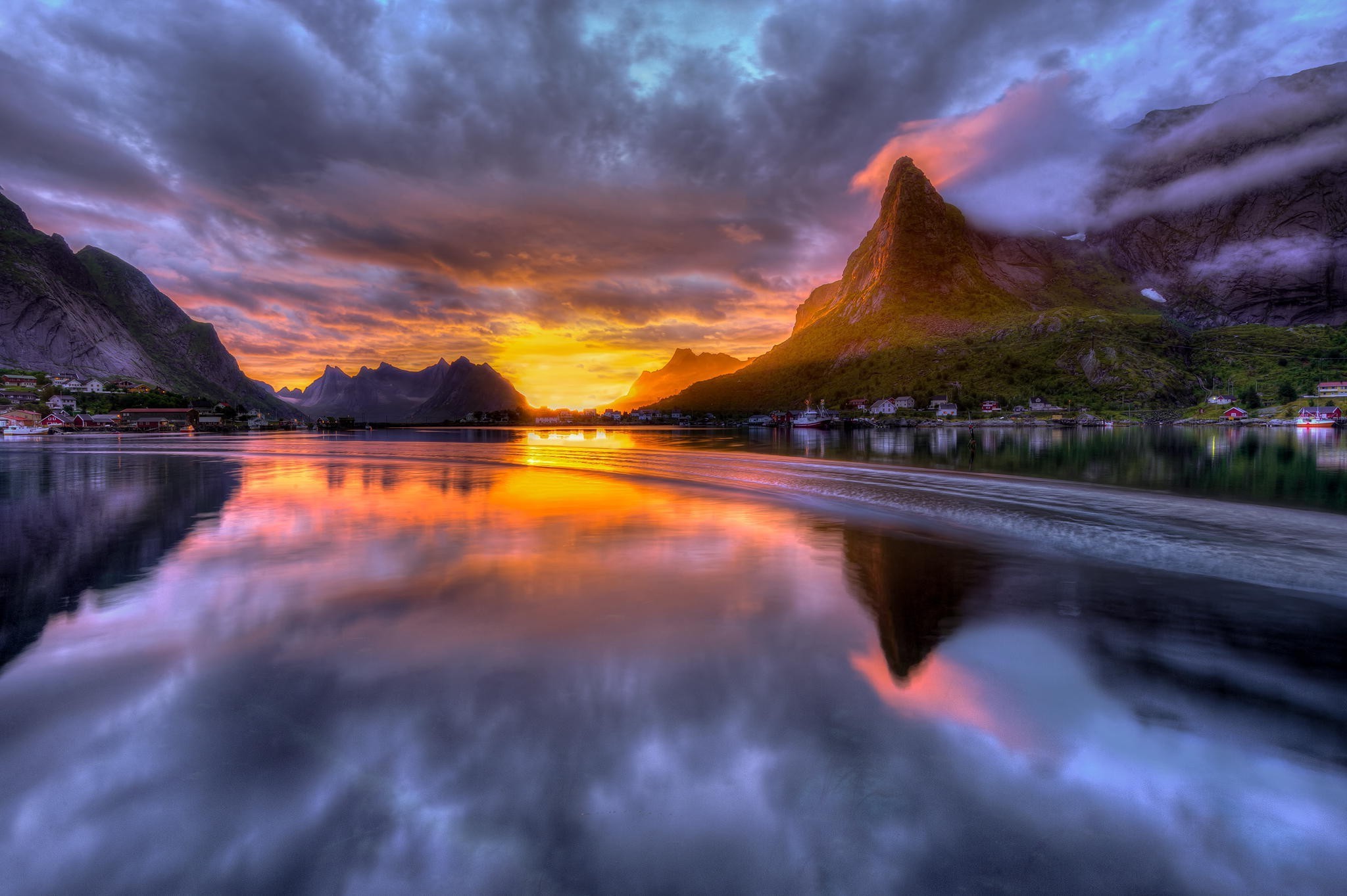 Sunrise over a Norwegian fjord with mountains and a village HD Wallpaper