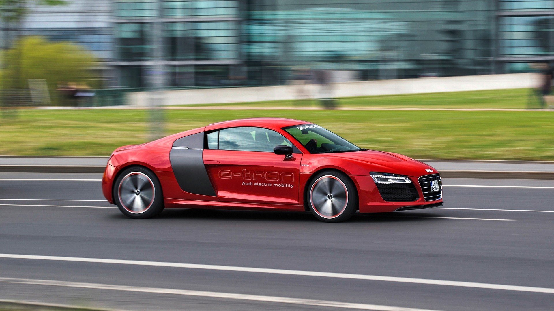 Red Audi R8 e-tron electric car driving on road HD Wallpaper