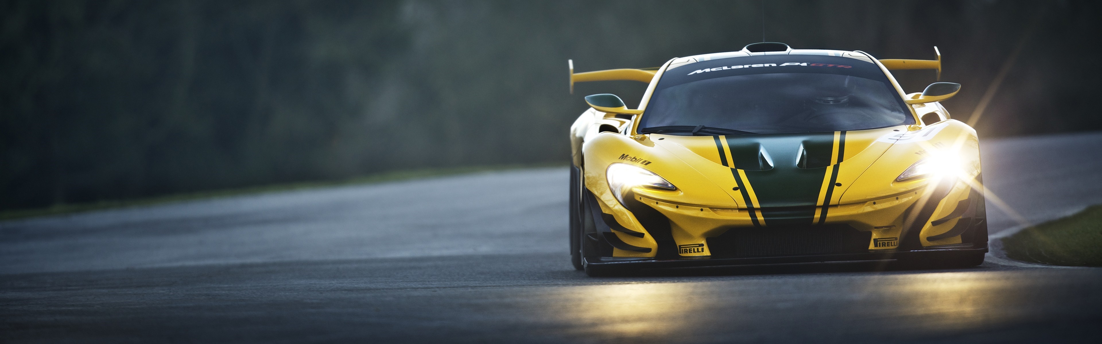 Yellow McLaren P1 GTR race car on track HD Wallpaper