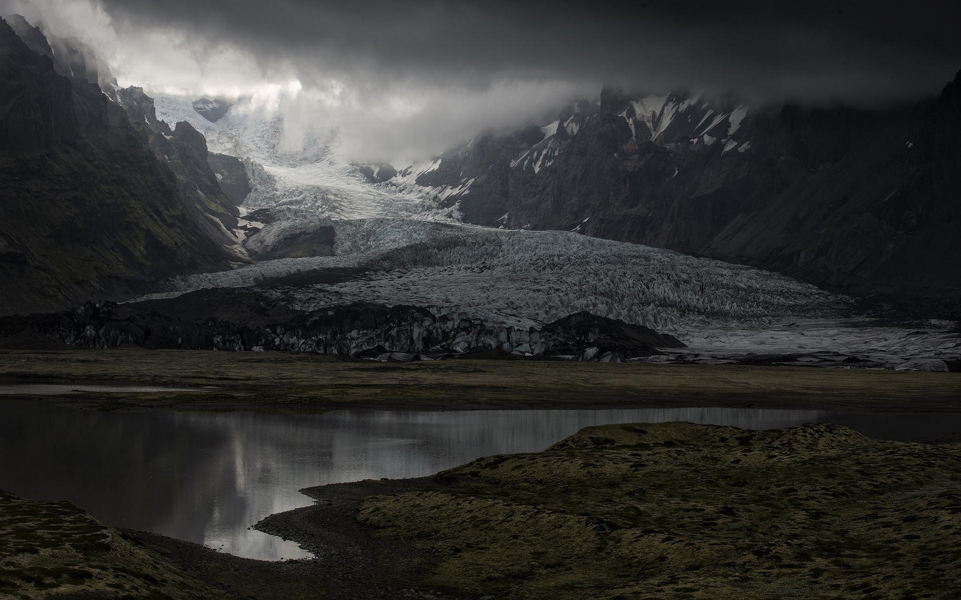 Glacier and lake in Iceland under cloudy skies HD Wallpaper