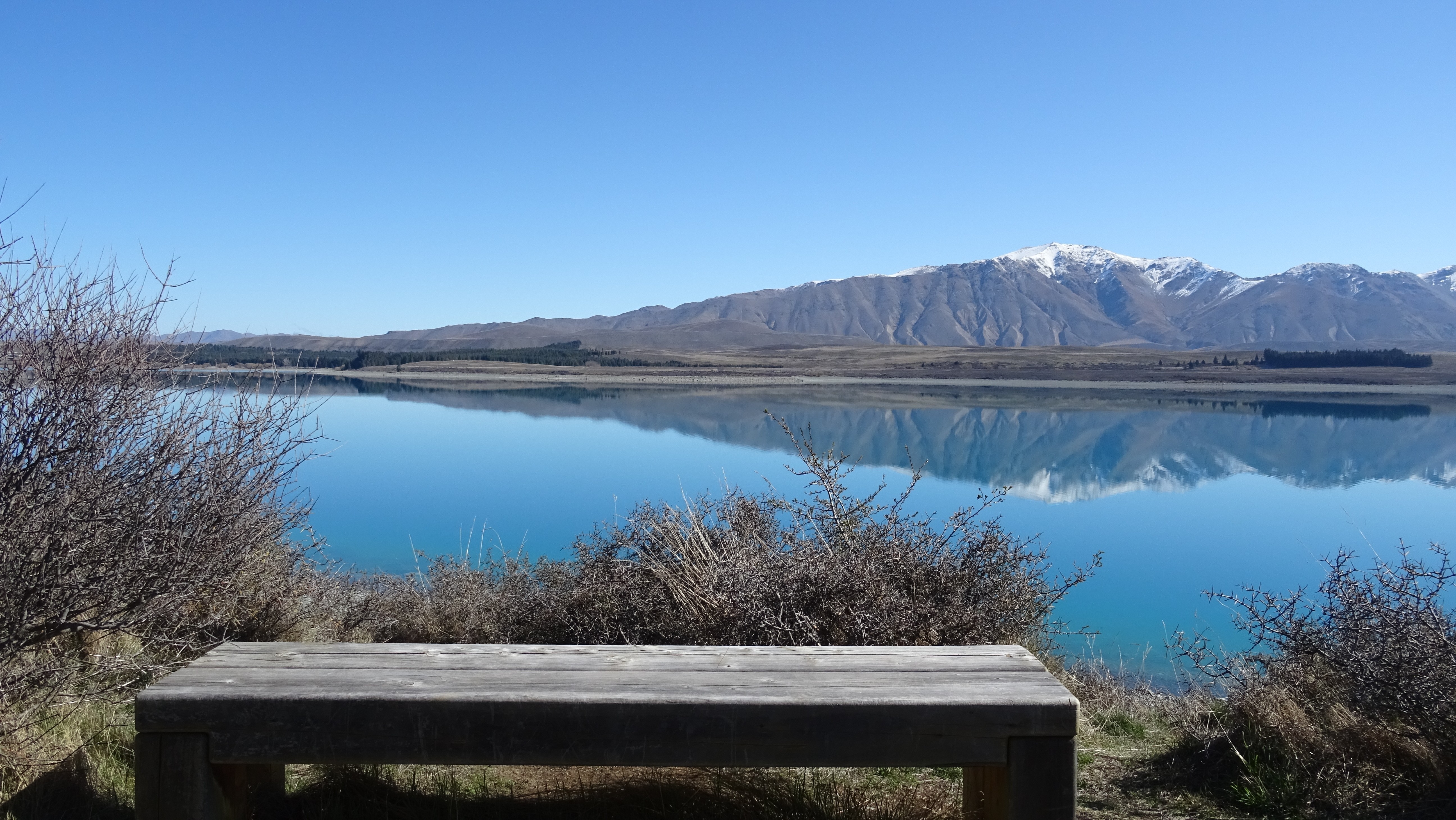 Lake Tekapo with Snowy Mountains and Bench, New Zealand HD Wallpaper