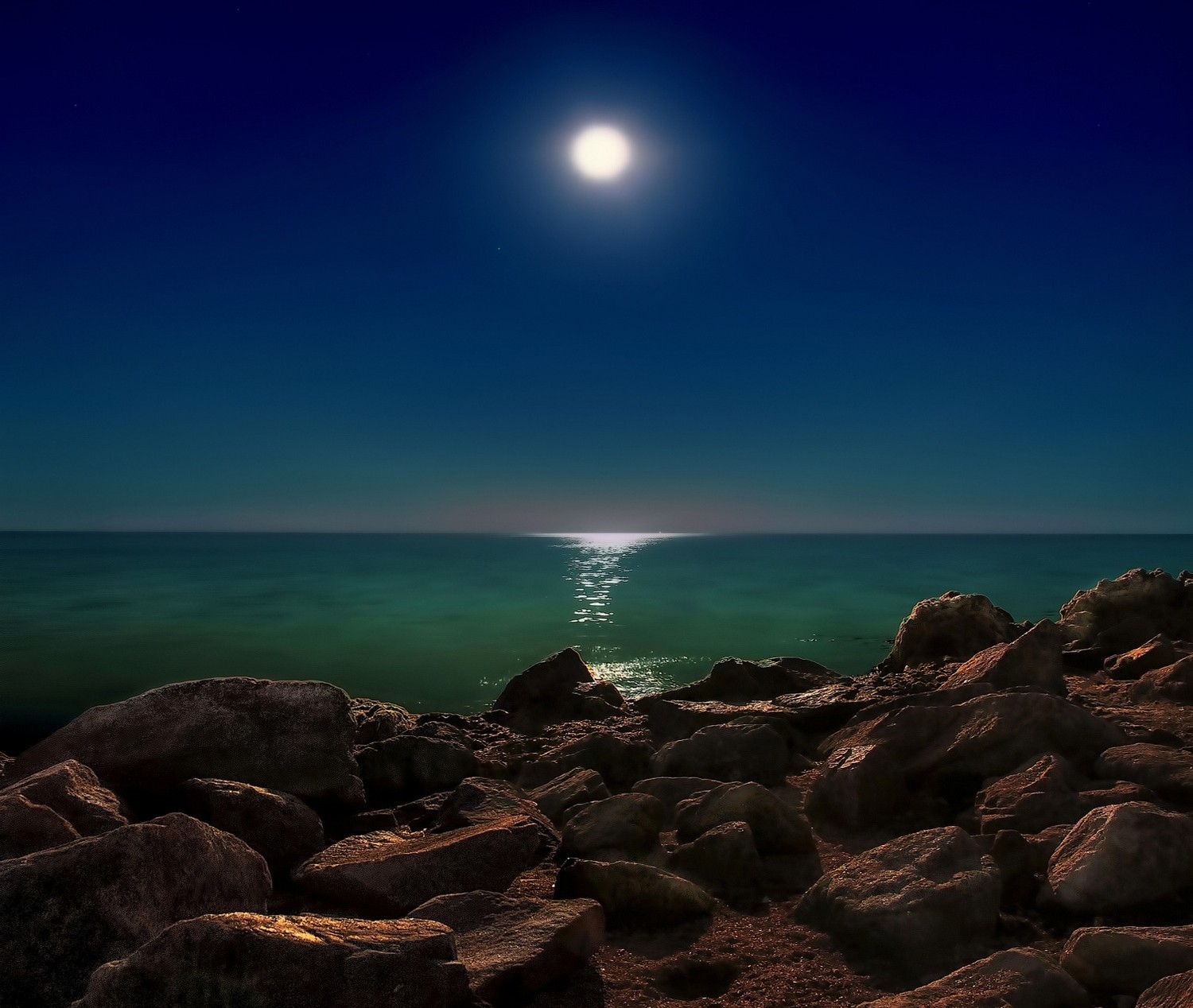 Moonlit Ocean Shore with Rocks HD Wallpaper
