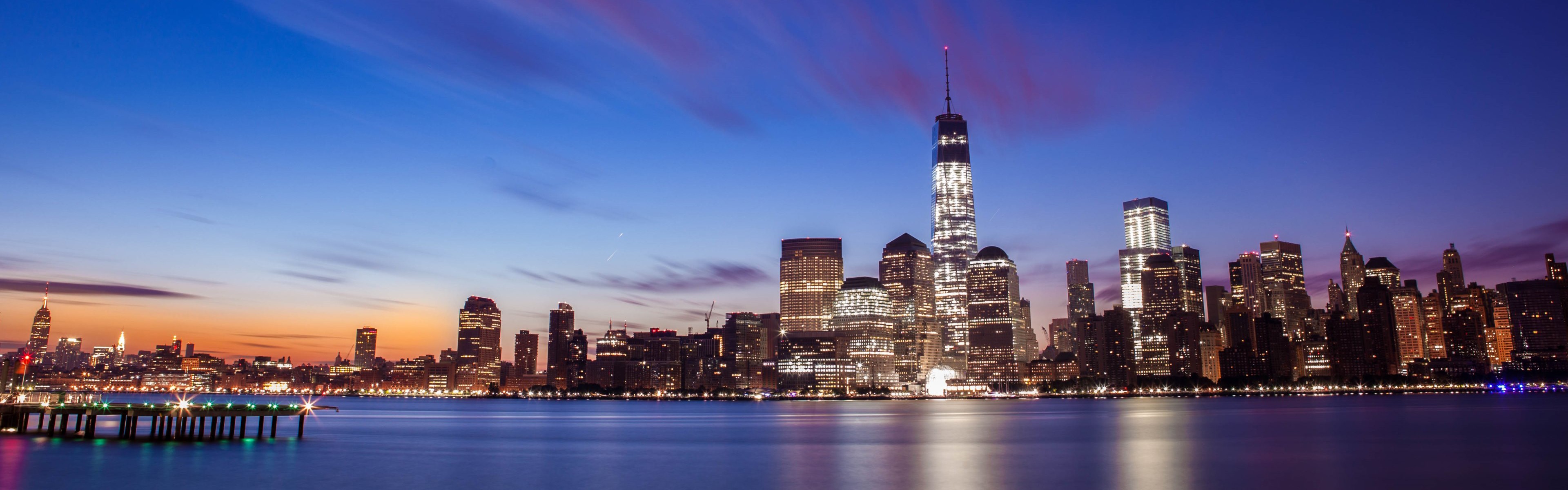 New York City skyline at dusk with reflections HD Wallpaper
