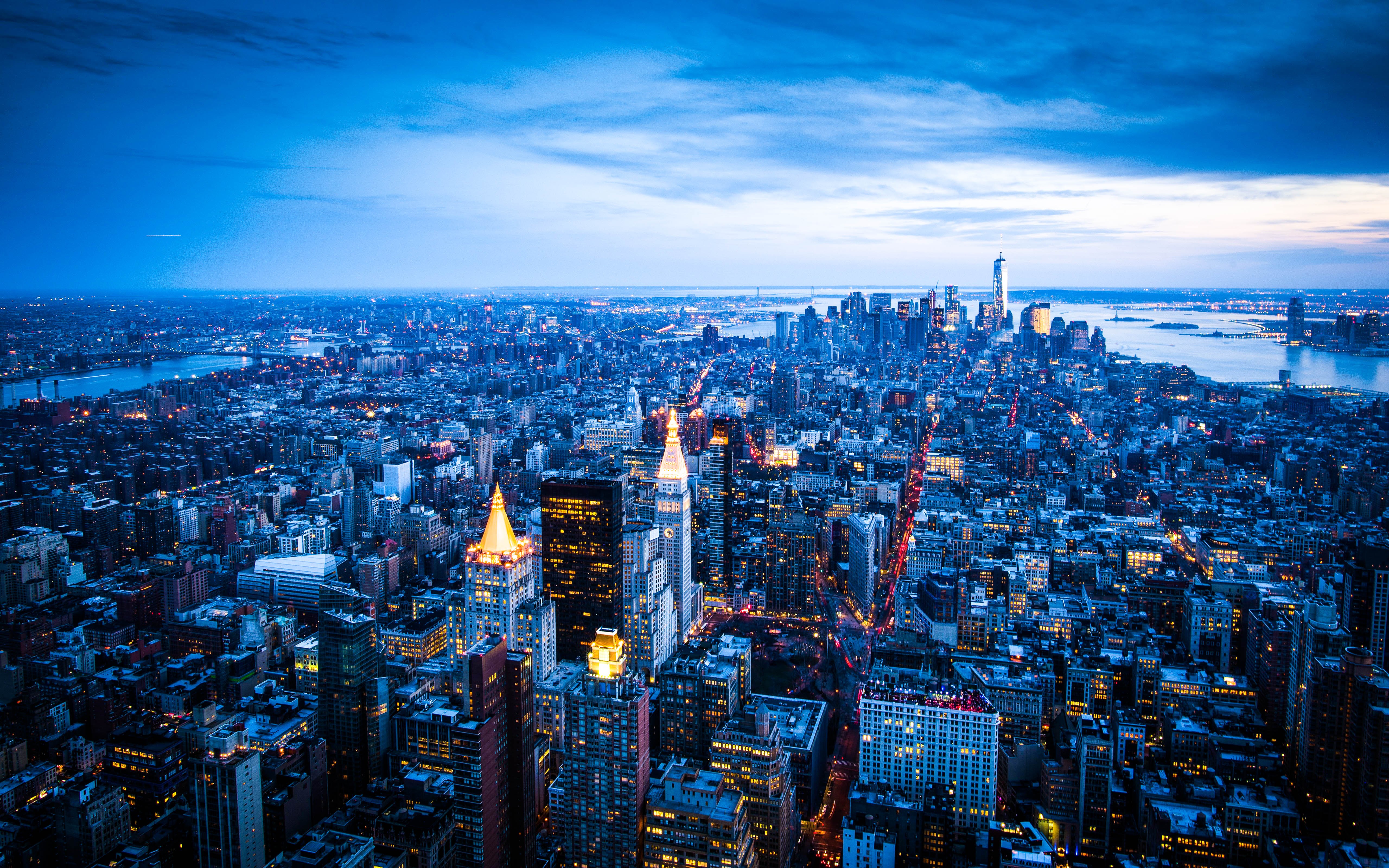 New York City skyline at dusk with city lights HD Wallpaper