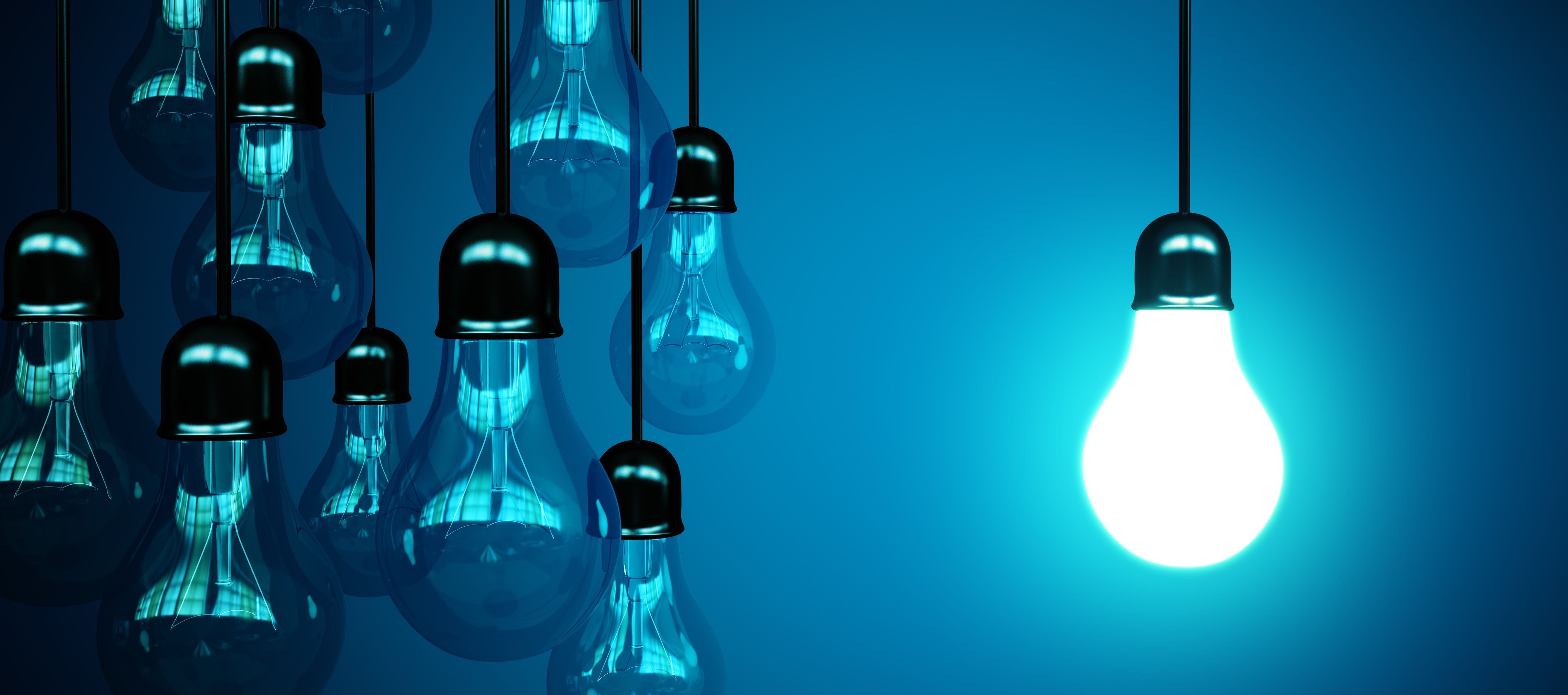 Light bulbs hanging against a blue background HD Wallpaper