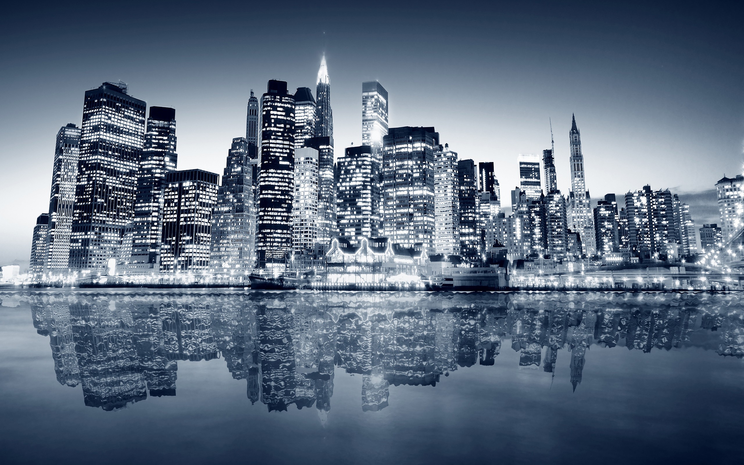 New York City skyline at night with water reflection HD Wallpaper