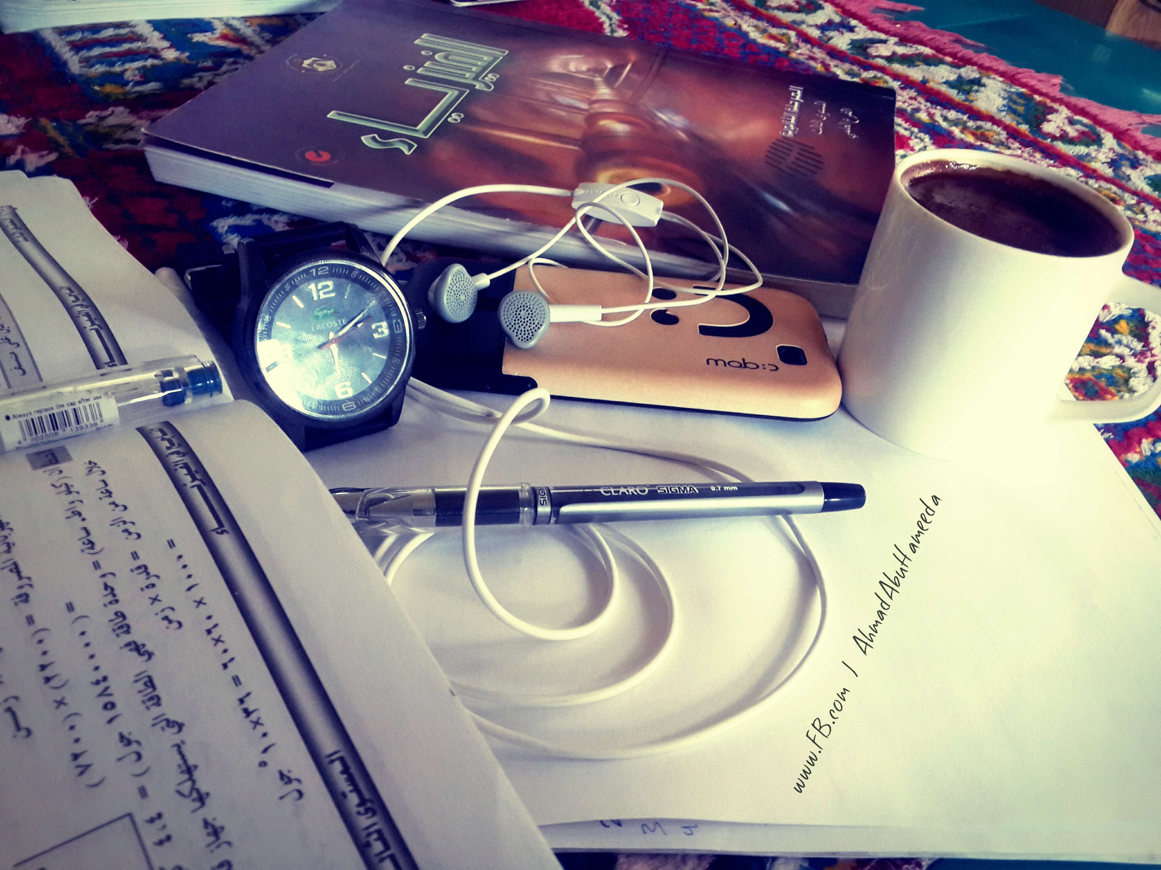 Student's study desk with physics book, coffee, and watch HD Wallpaper