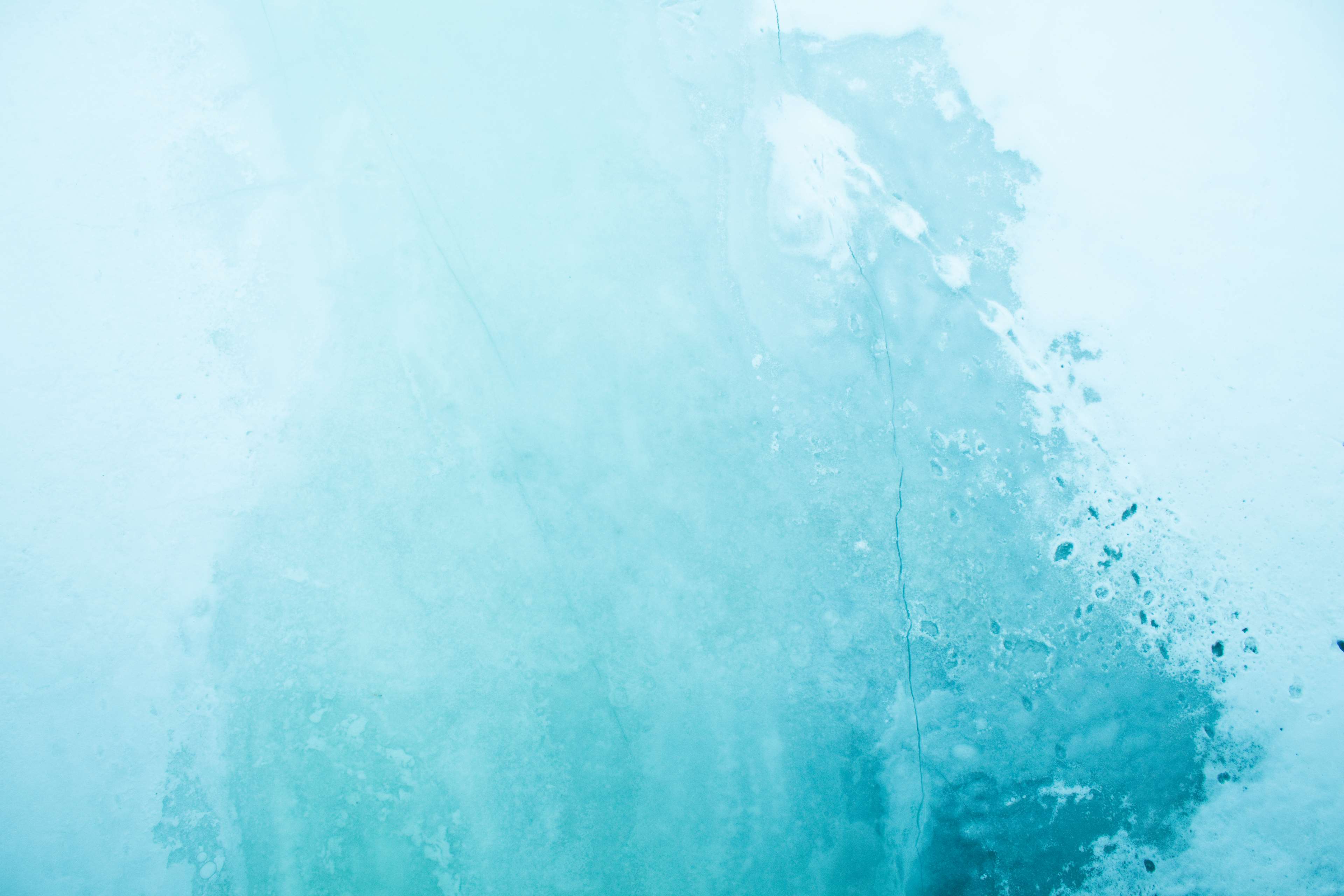 Blue ice with white patches and cracks HD Wallpaper