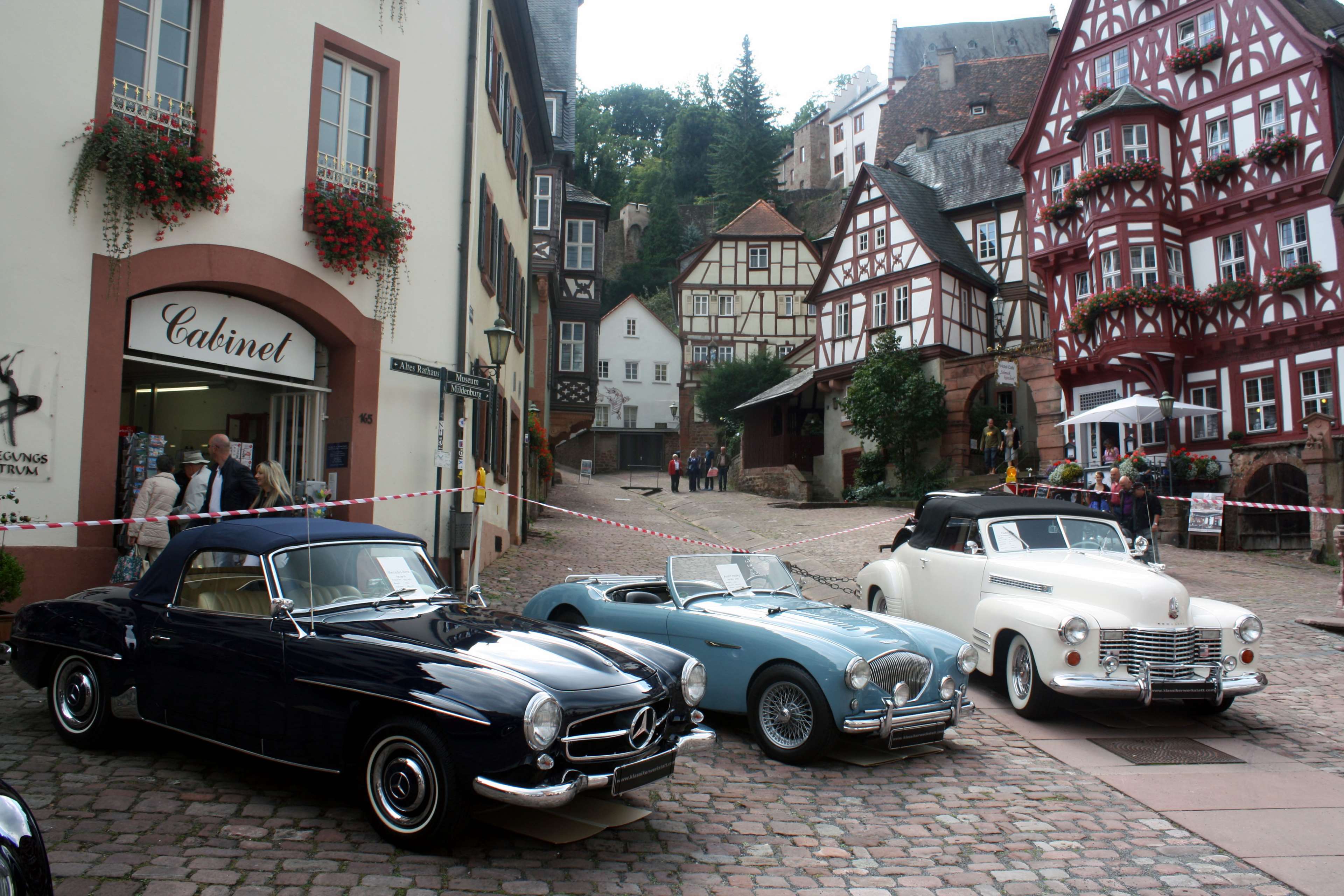 Mercedes and classic cars in a European town HD Wallpaper