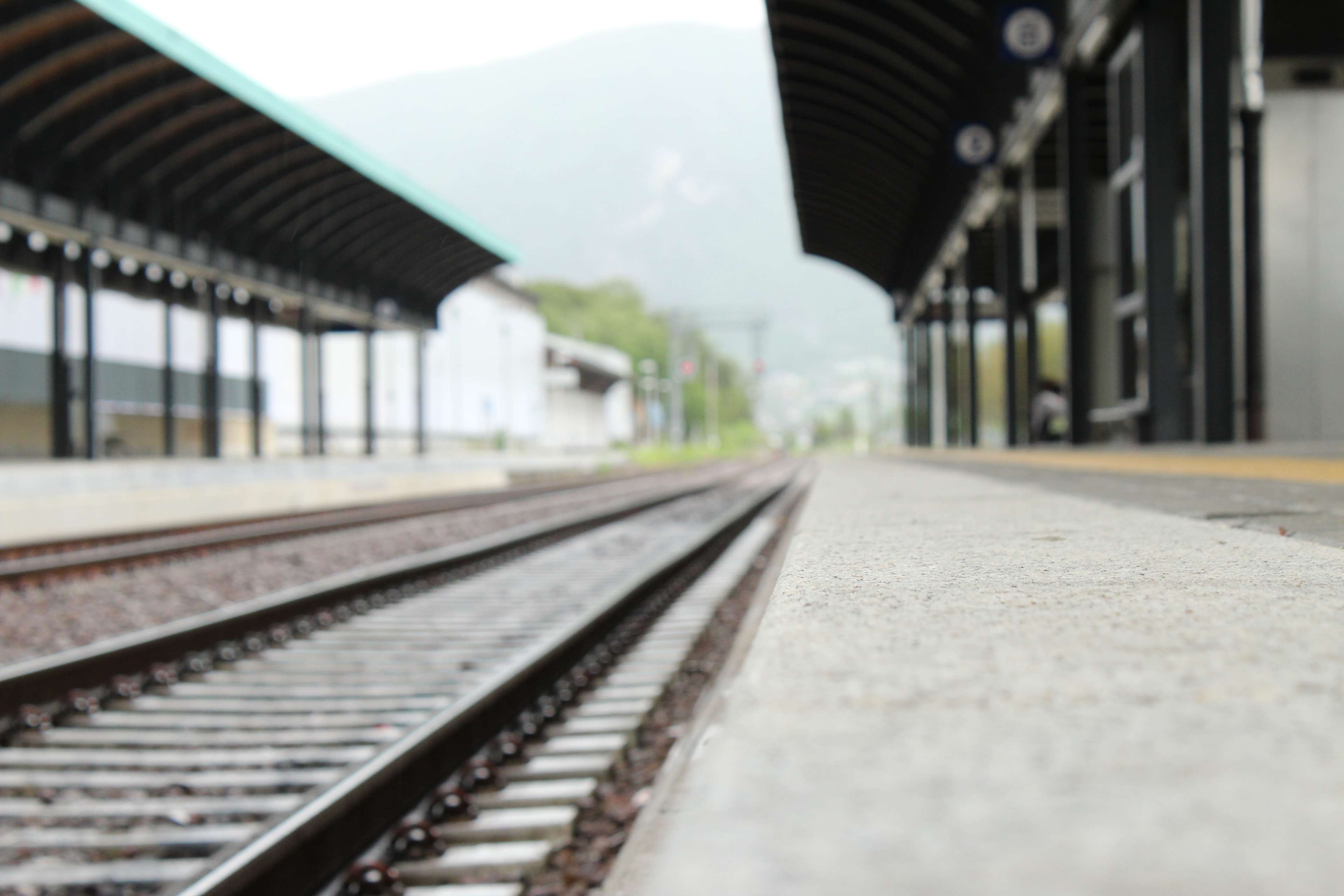 Railway station with tracks and platforms HD Wallpaper