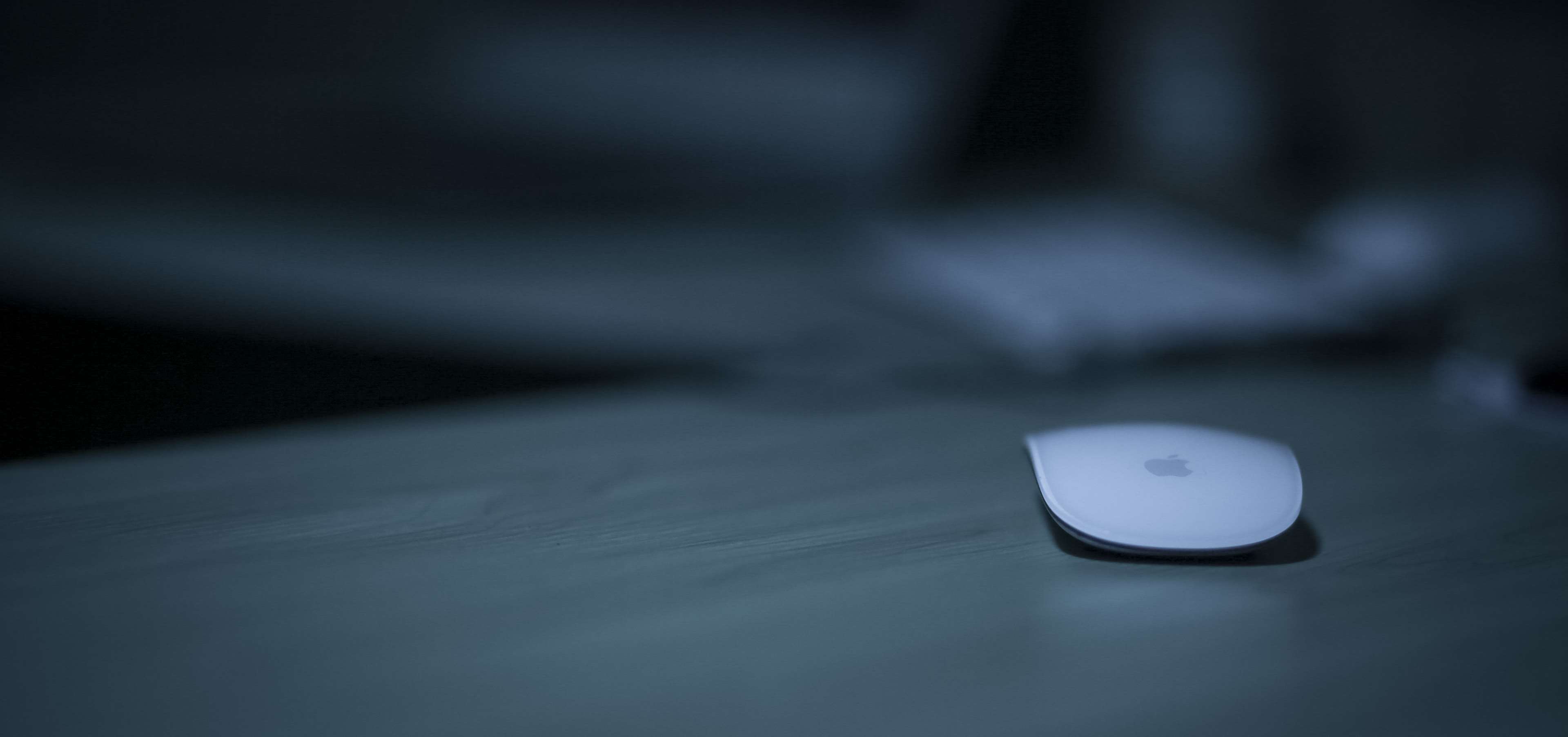 Apple Magic Mouse on a table HD Wallpaper
