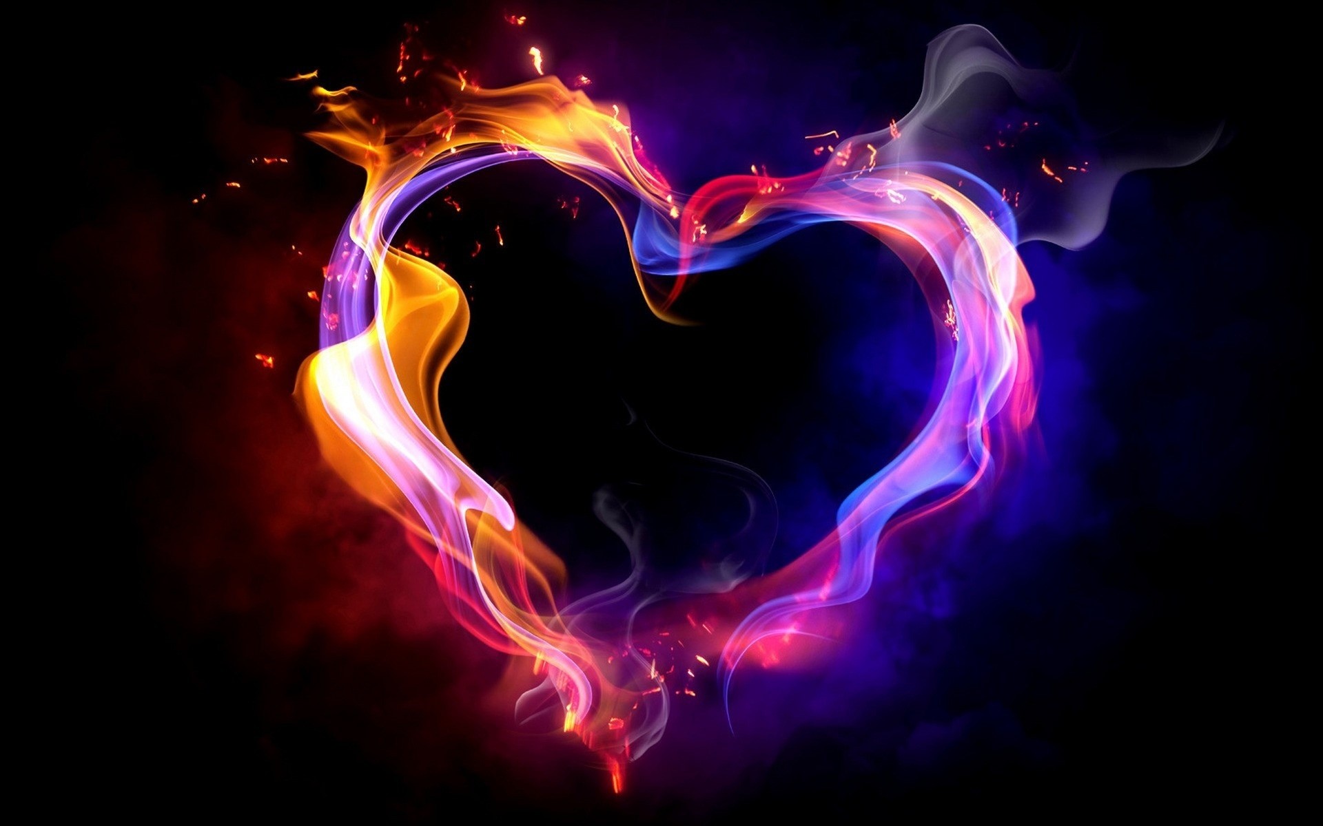 Heart shape made of colorful smoke and fire HD Wallpaper