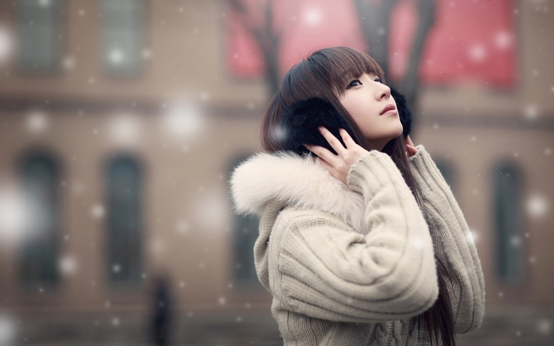 Asian Girl Wearing Cozy Jacket Enjoying Snowfall HD Wallpaper