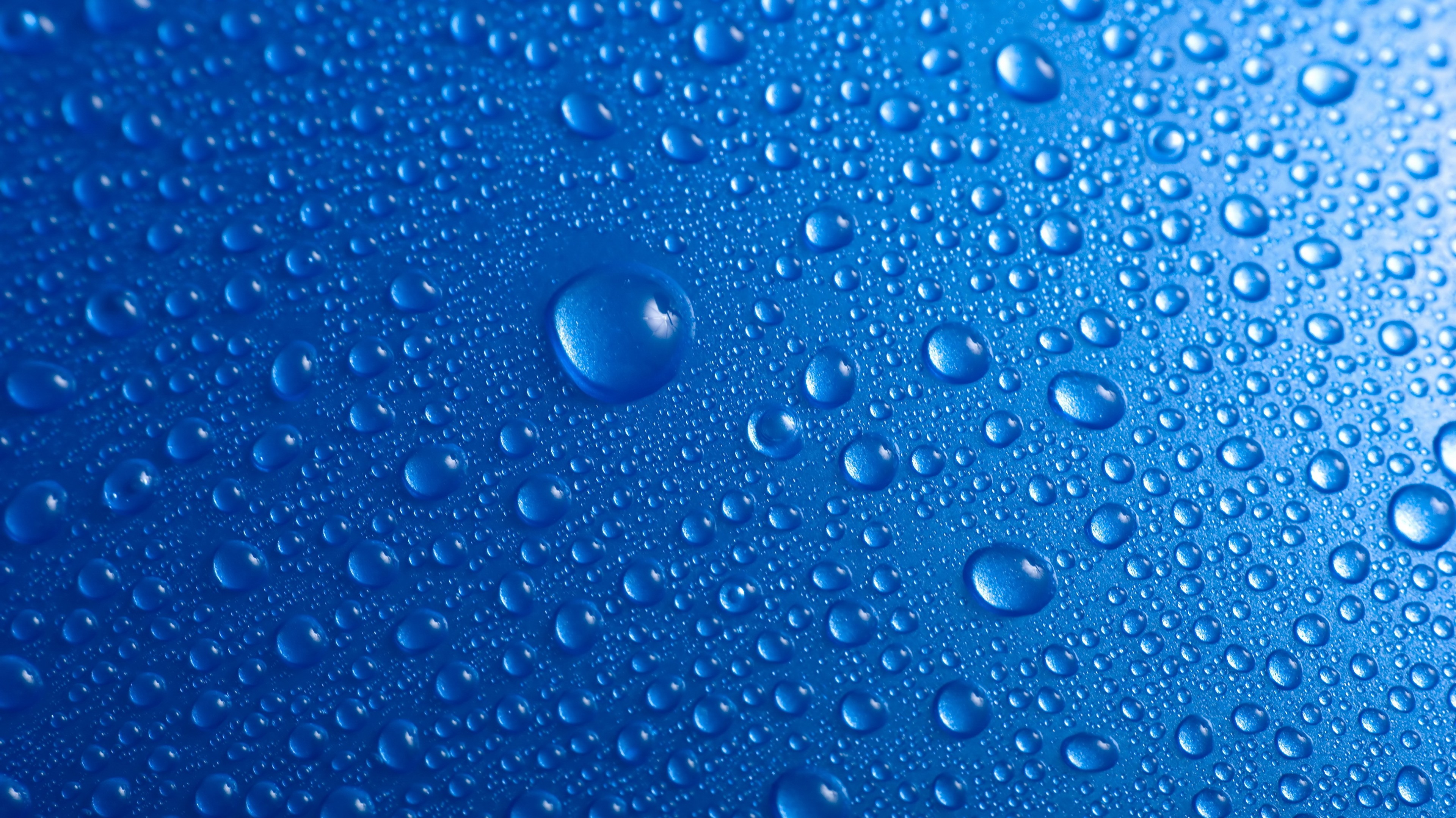 Water drops on blue surface HD Wallpaper