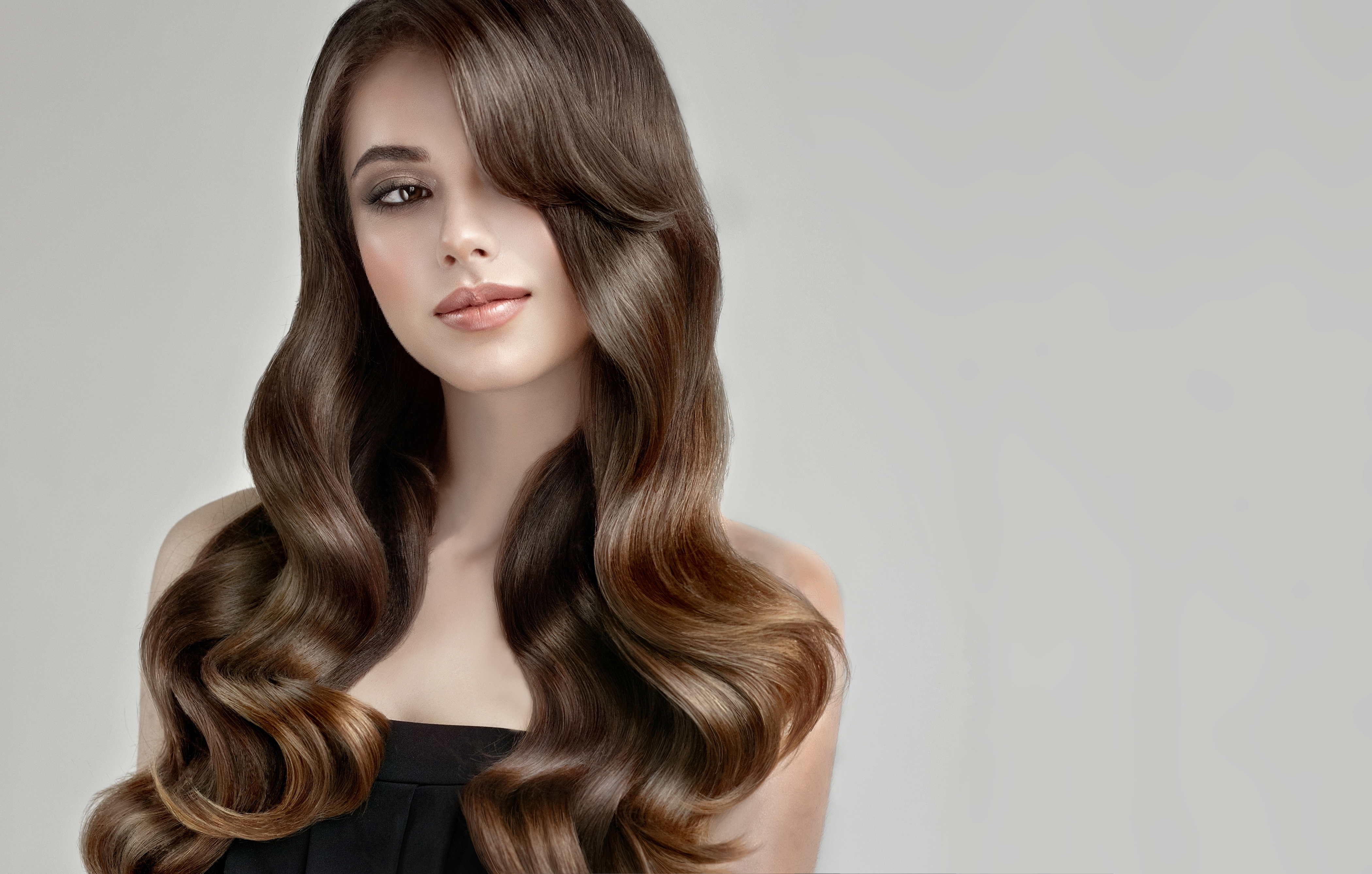 Woman with long wavy brown hair HD Wallpaper
