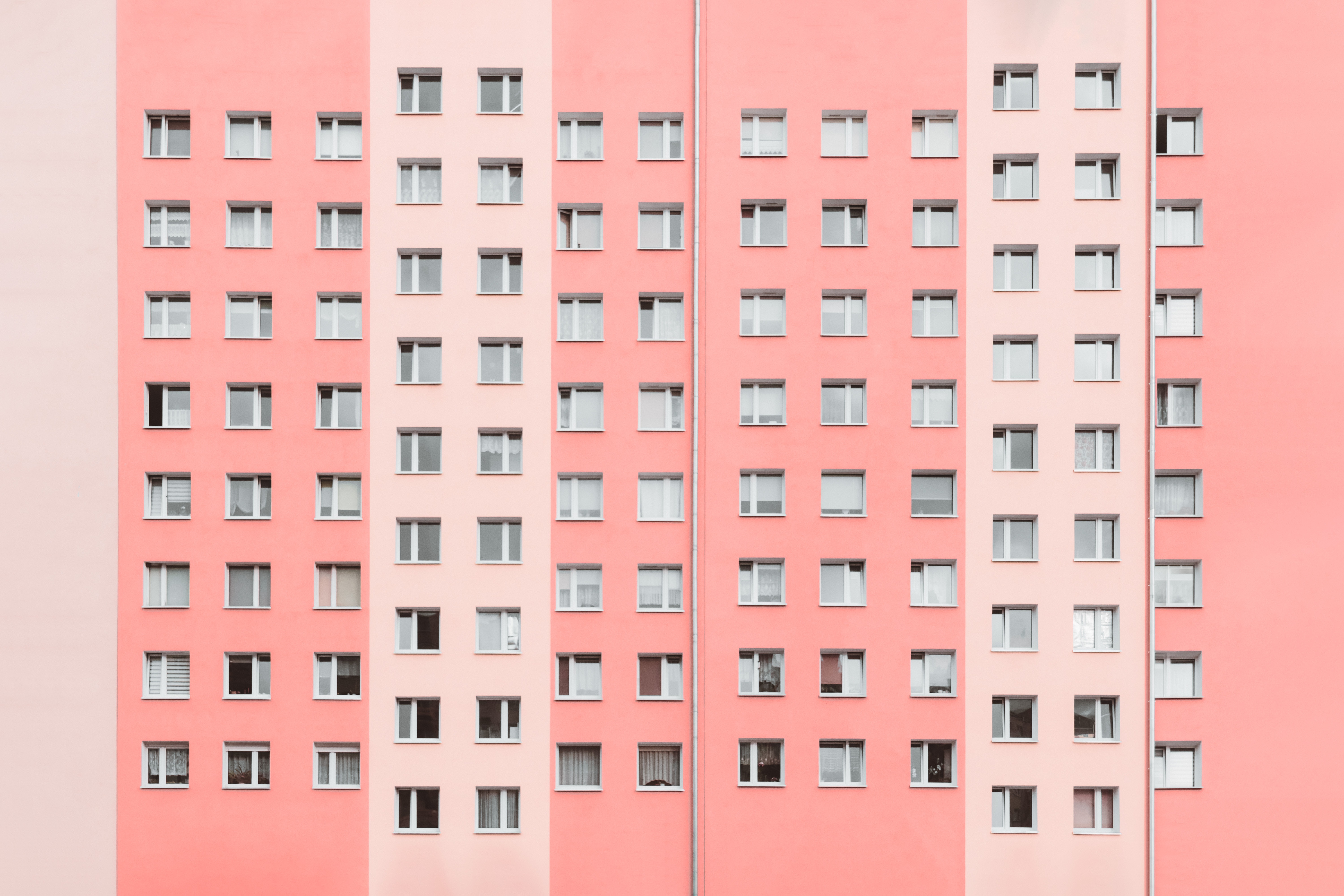 Pink and Lilac Apartment Building Facade with Windows HD Wallpaper
