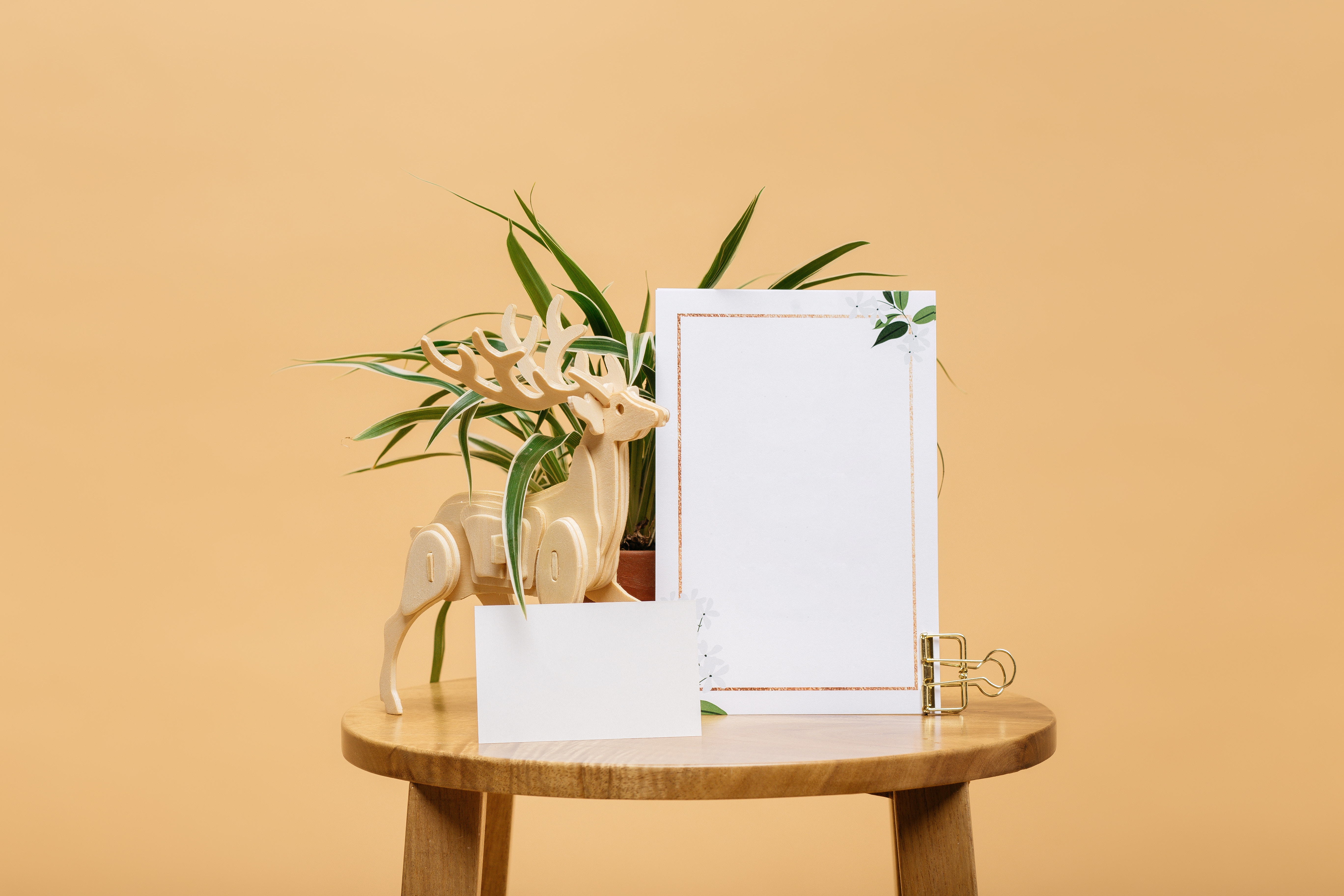 Wooden deer and plant on stool with cards HD Wallpaper