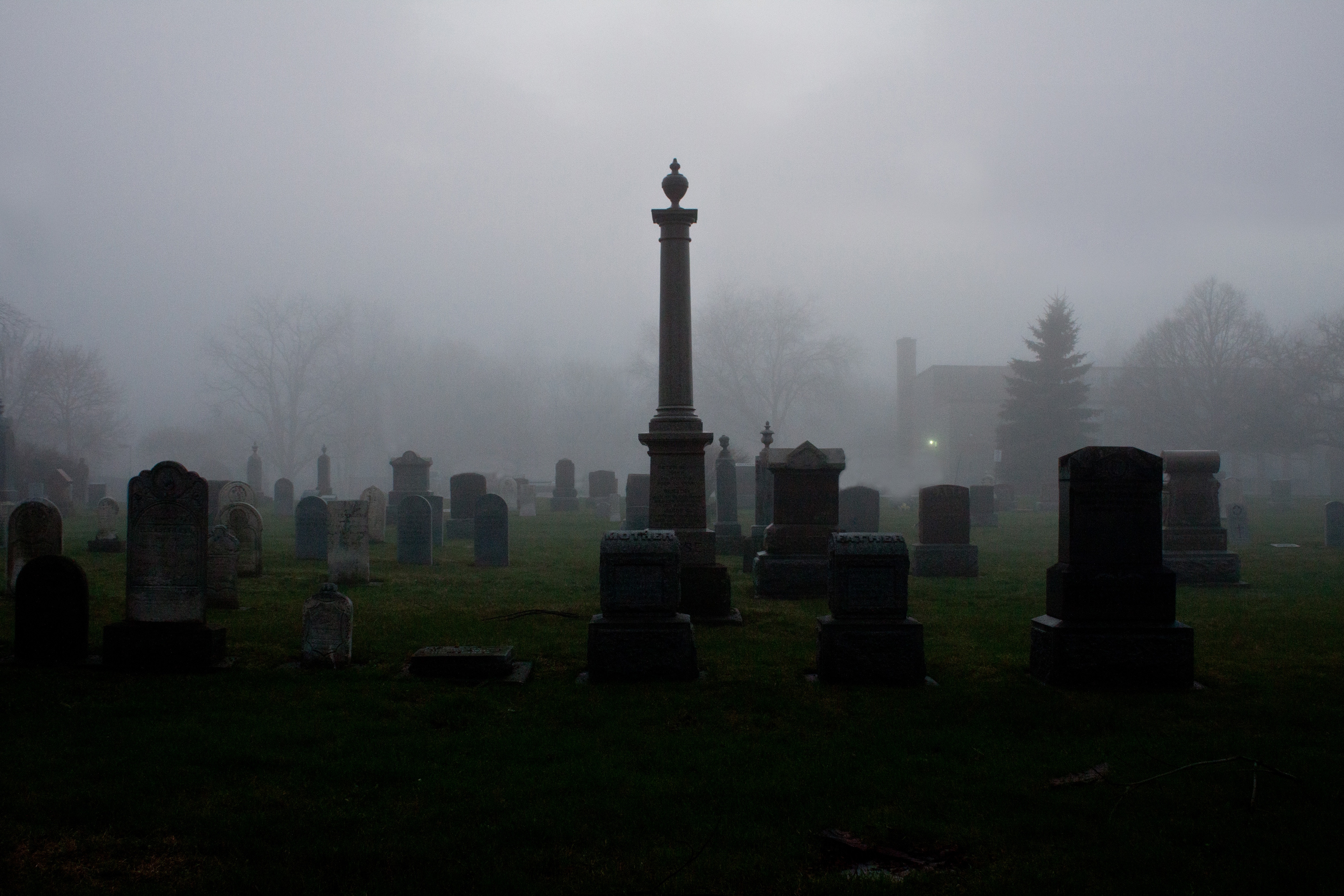 Cemetery with tombstones in fog HD Wallpaper