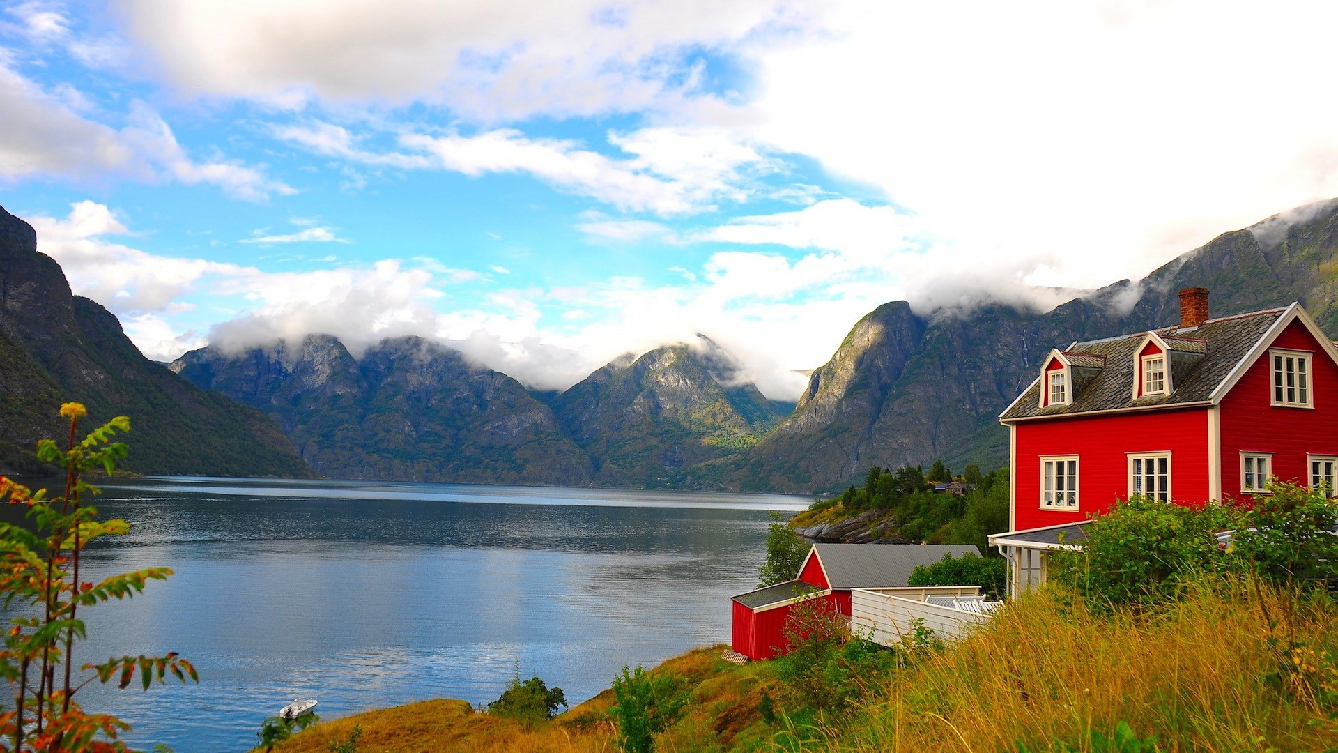 Red house by a fjord with mountains HD Wallpaper