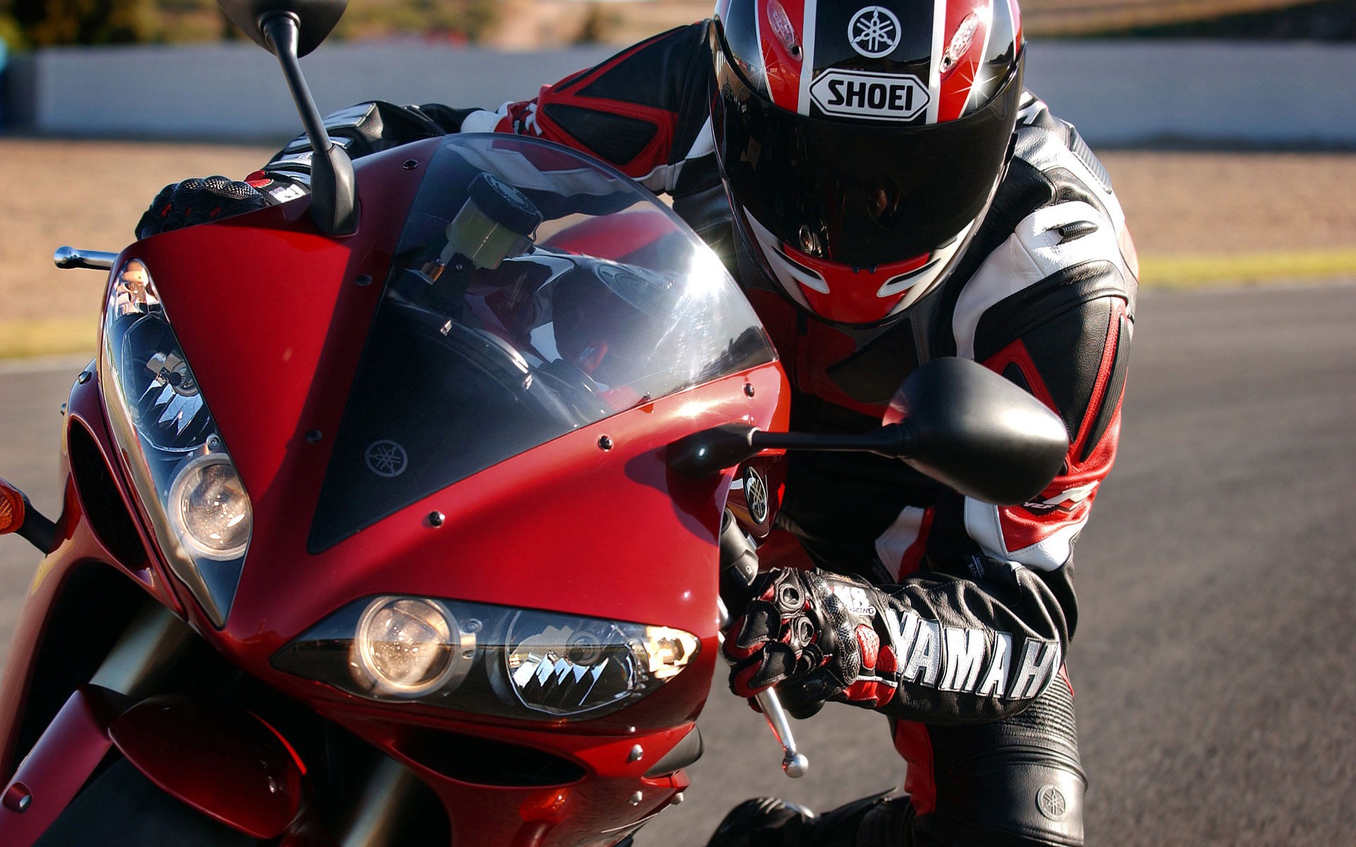 Yamaha motorcycle rider in racing suit HD Wallpaper