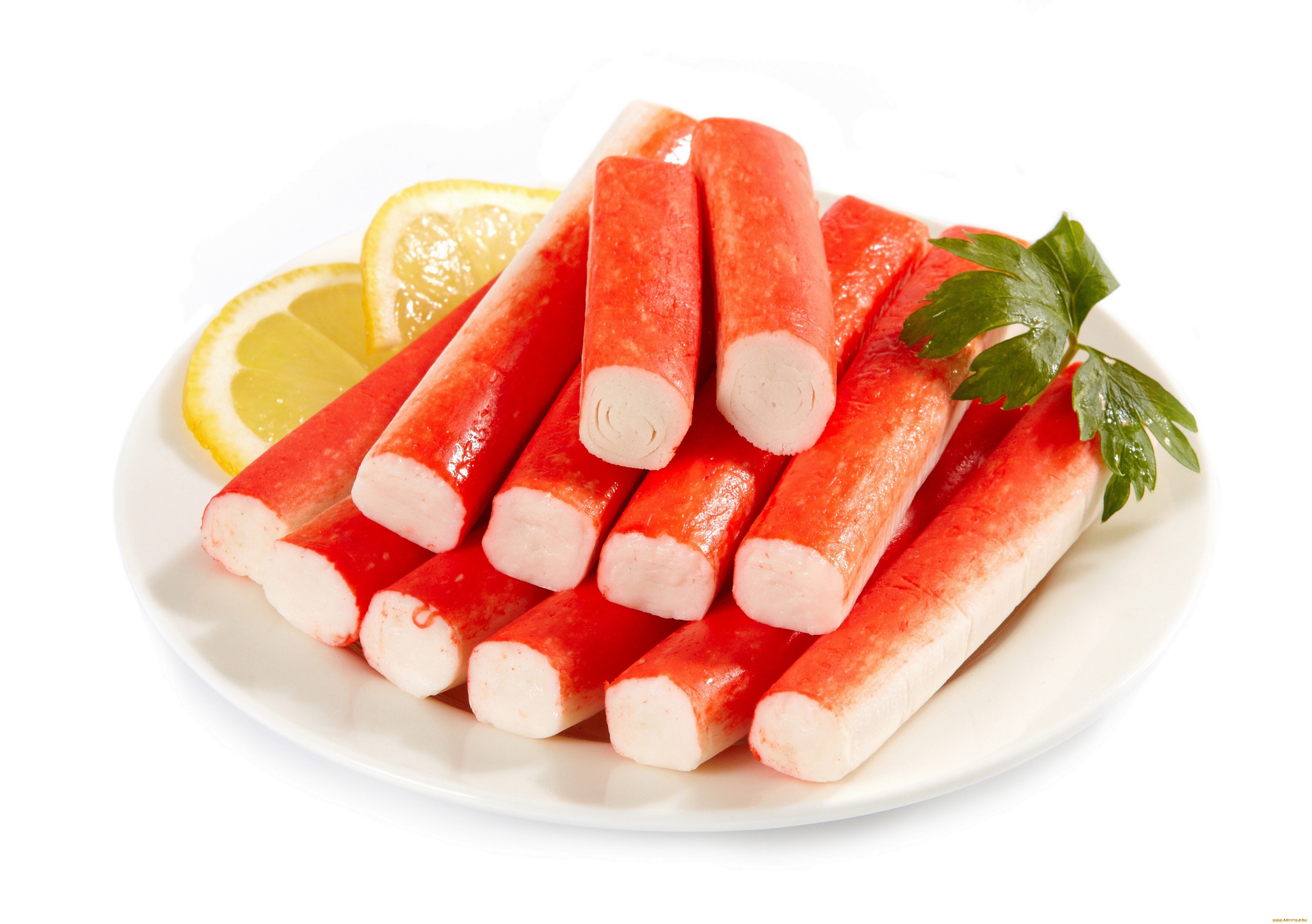 Crab sticks with lemon and parsley on a plate HD Wallpaper