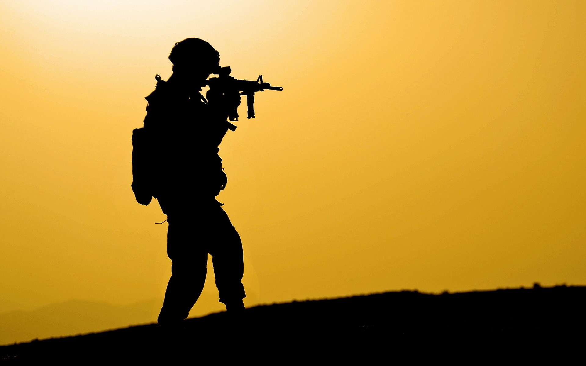 Soldier aiming a rifle at sunset HD Wallpaper