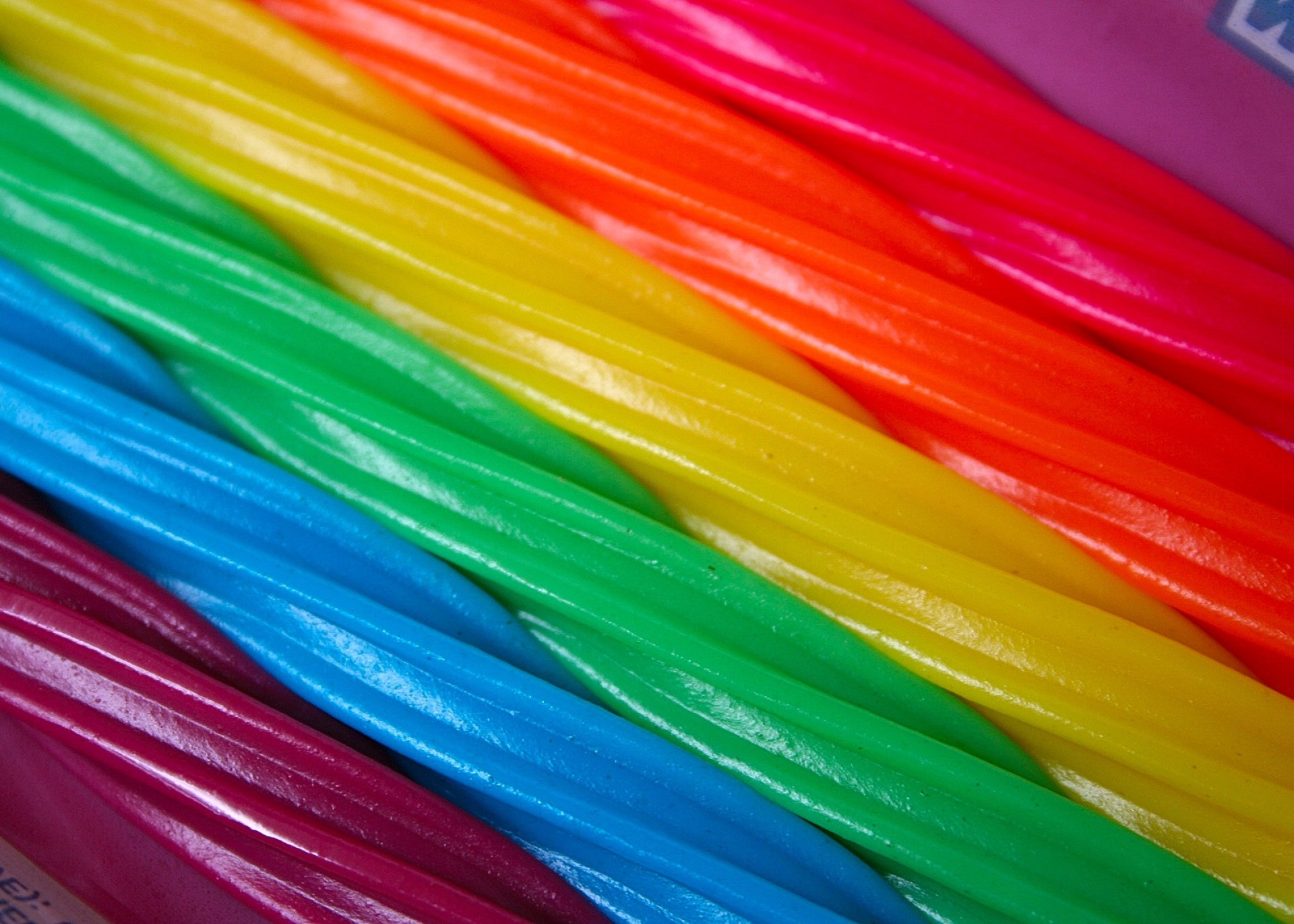 Rainbow licorice candy sticks close-up HD Wallpaper