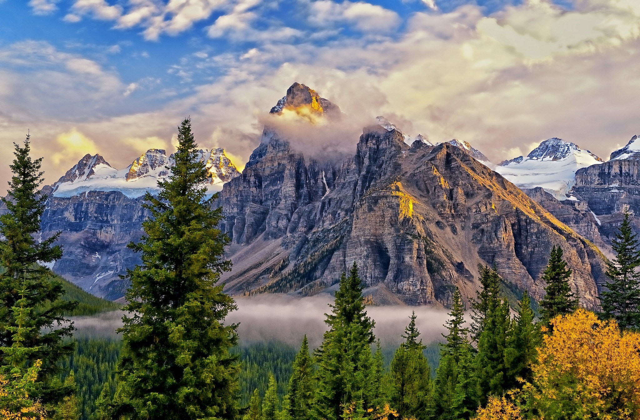 Mountain range with trees and clouds HD Wallpaper