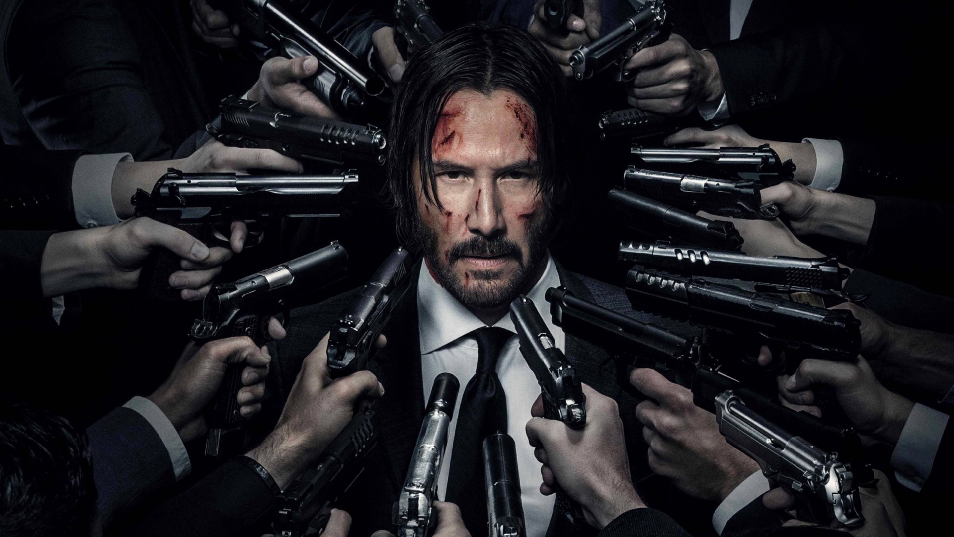 John Wick surrounded by guns HD Wallpaper