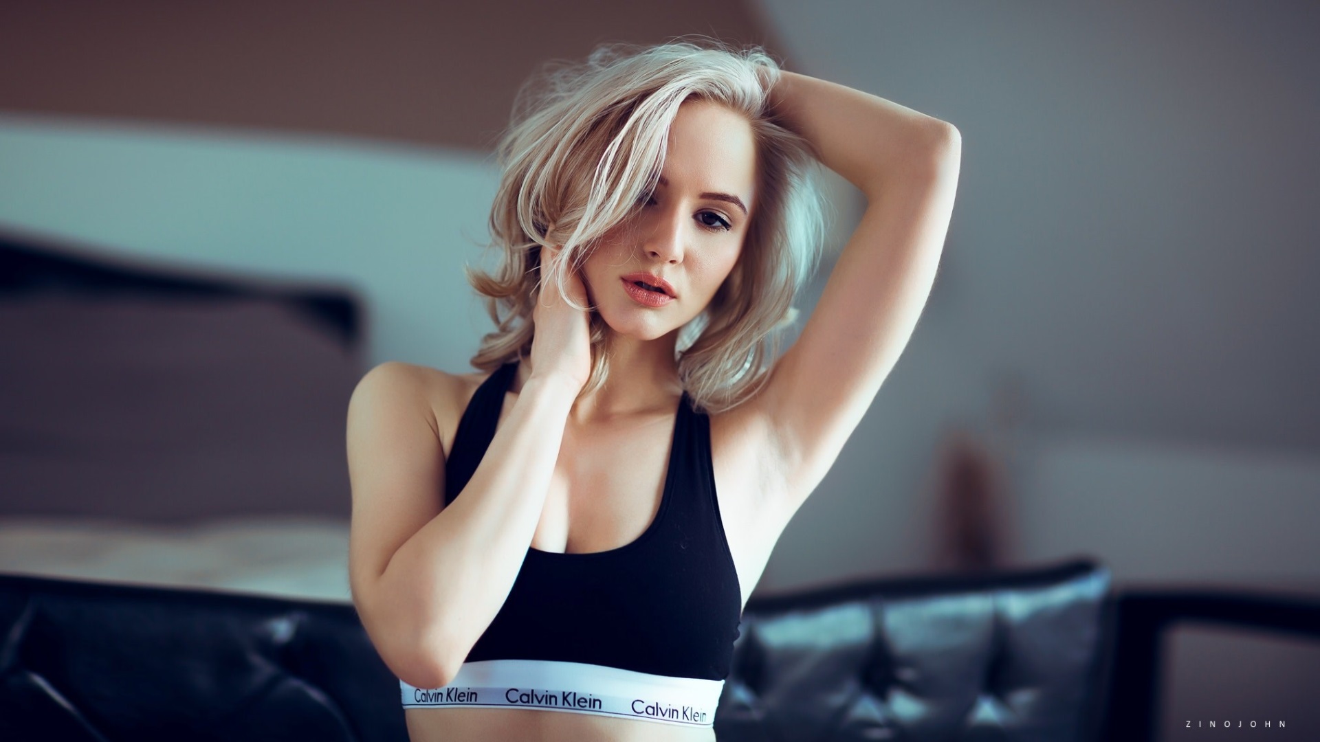 Blonde Woman in Casual Sportswear Relaxing Indoors HD Wallpaper