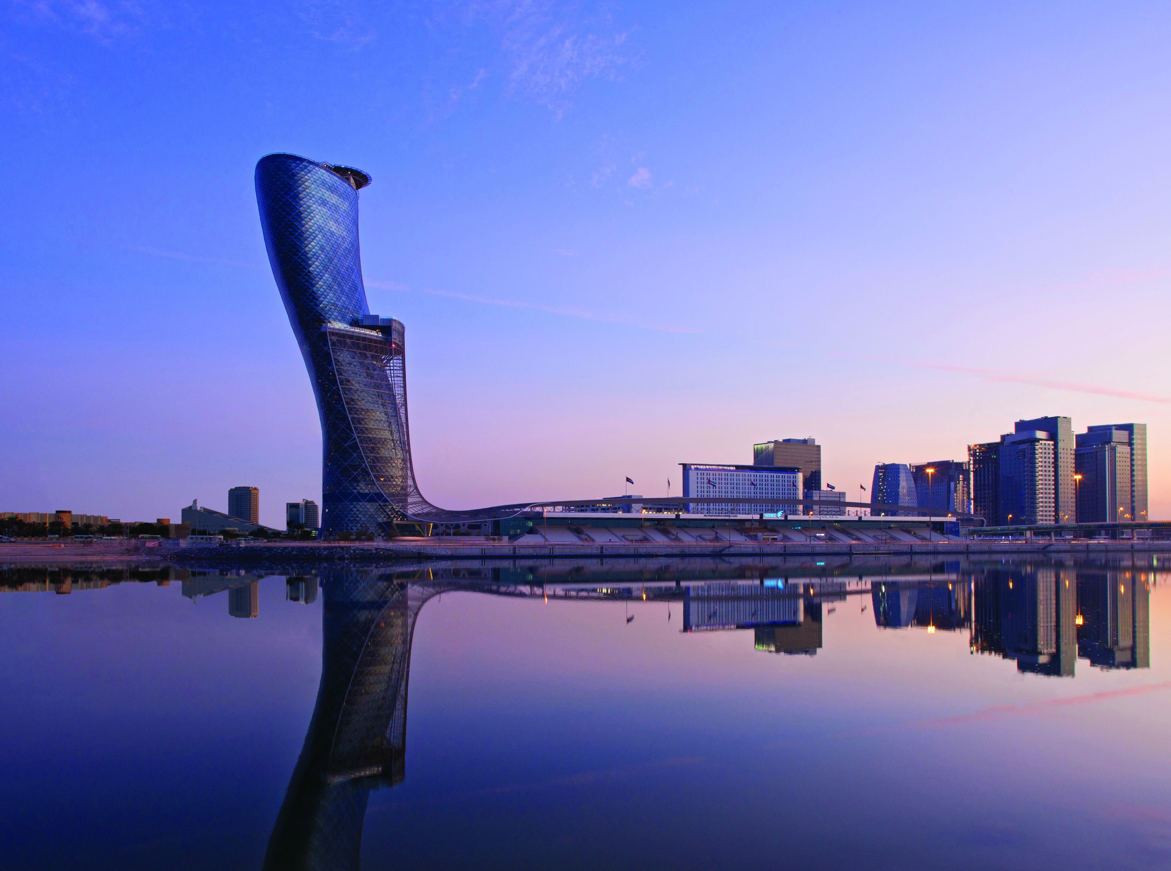 Capital Gate Building and Skyline Reflection 4K HD Wallpaper